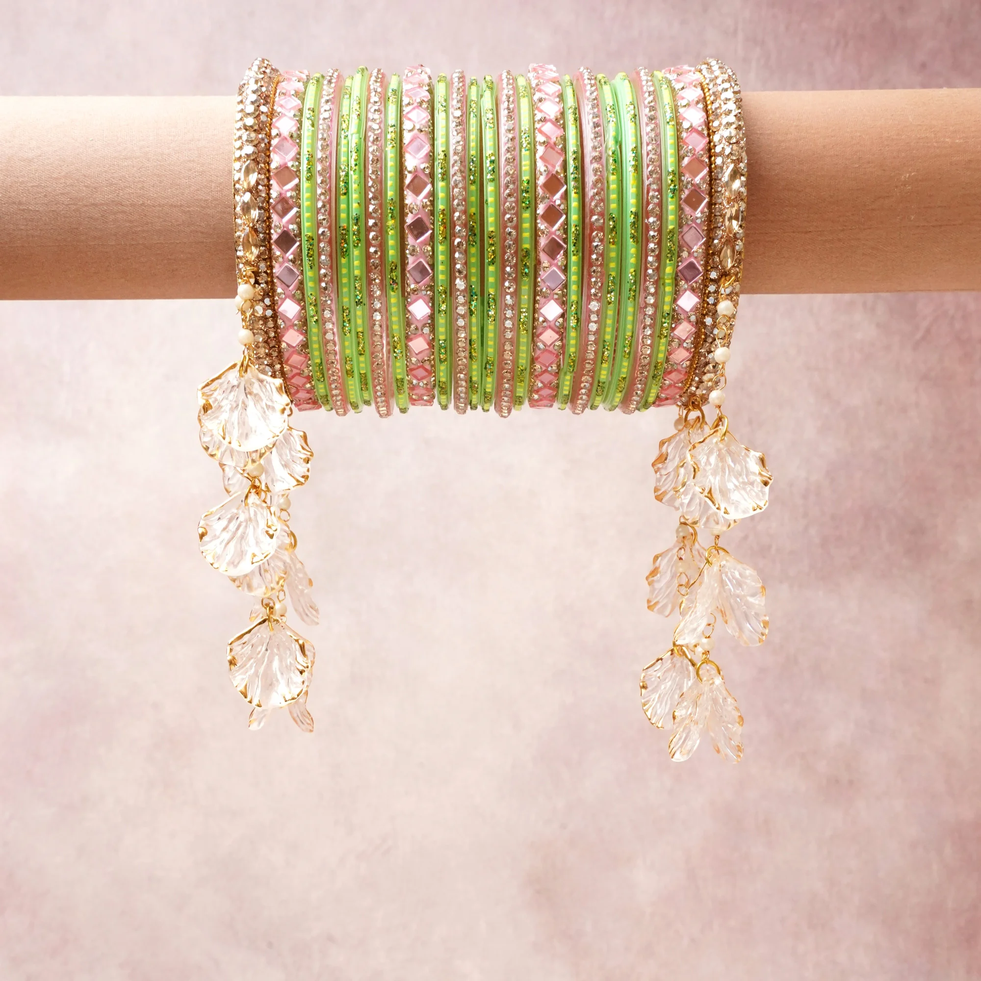 A commanding pastel pink anchors this beautiful set, enriched with accents of lime green, gold that add depth and dimension.

Featuring a striking composition of rhinestone, crystal, metal, this set carries intricate craftsmanship and strong presence. Grand in form, it is created for moments that deserve to be marked.