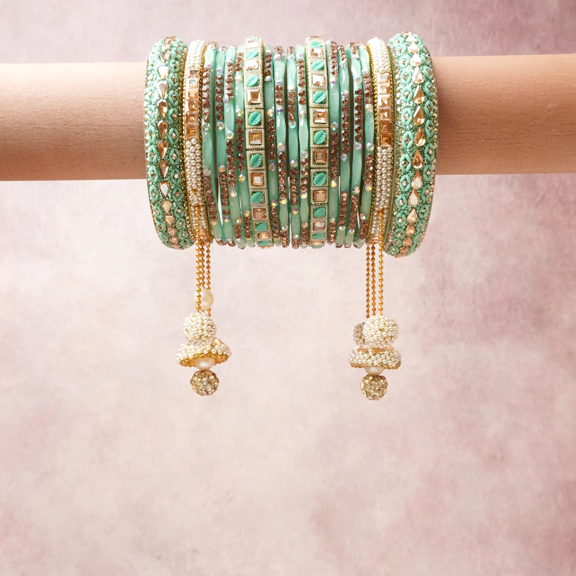 A commanding mint green anchors this beautiful set, enriched with accents of gold, ivory, champagne that add depth and dimension.

Featuring a striking composition of glass beads, rhinestones, pearl beads, this set carries intricate craftsmanship and strong presence. Grand in form, it is created for moments that deserve to be marked.