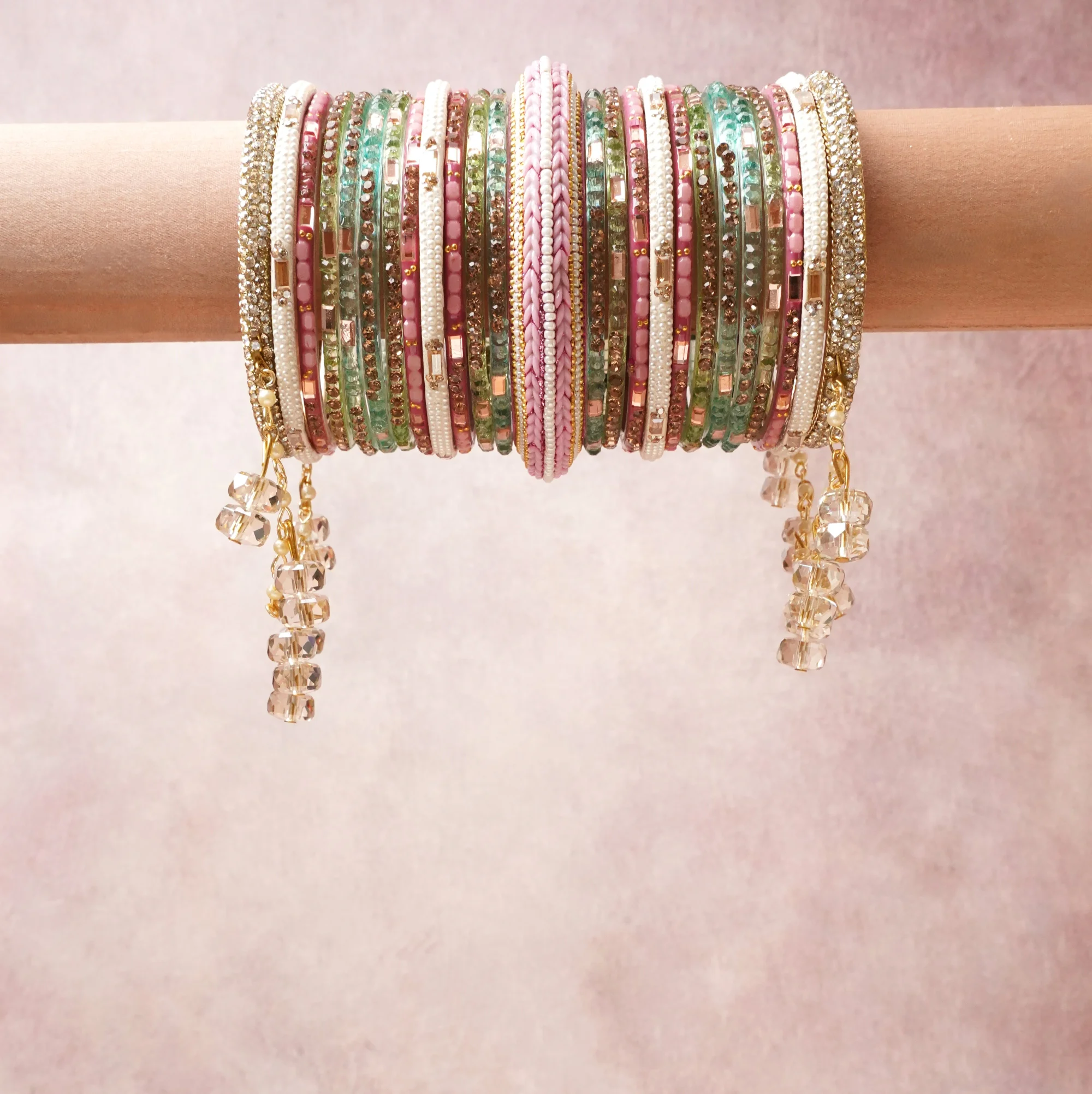 A commanding pastel pink anchors this beautiful set, enriched with accents of mint green, champagne gold, ivory that add depth and dimension.

Featuring a striking composition of beaded crystal bracelet set, this set carries intricate craftsmanship and strong presence. Grand in form, it is created for moments that deserve to be marked.