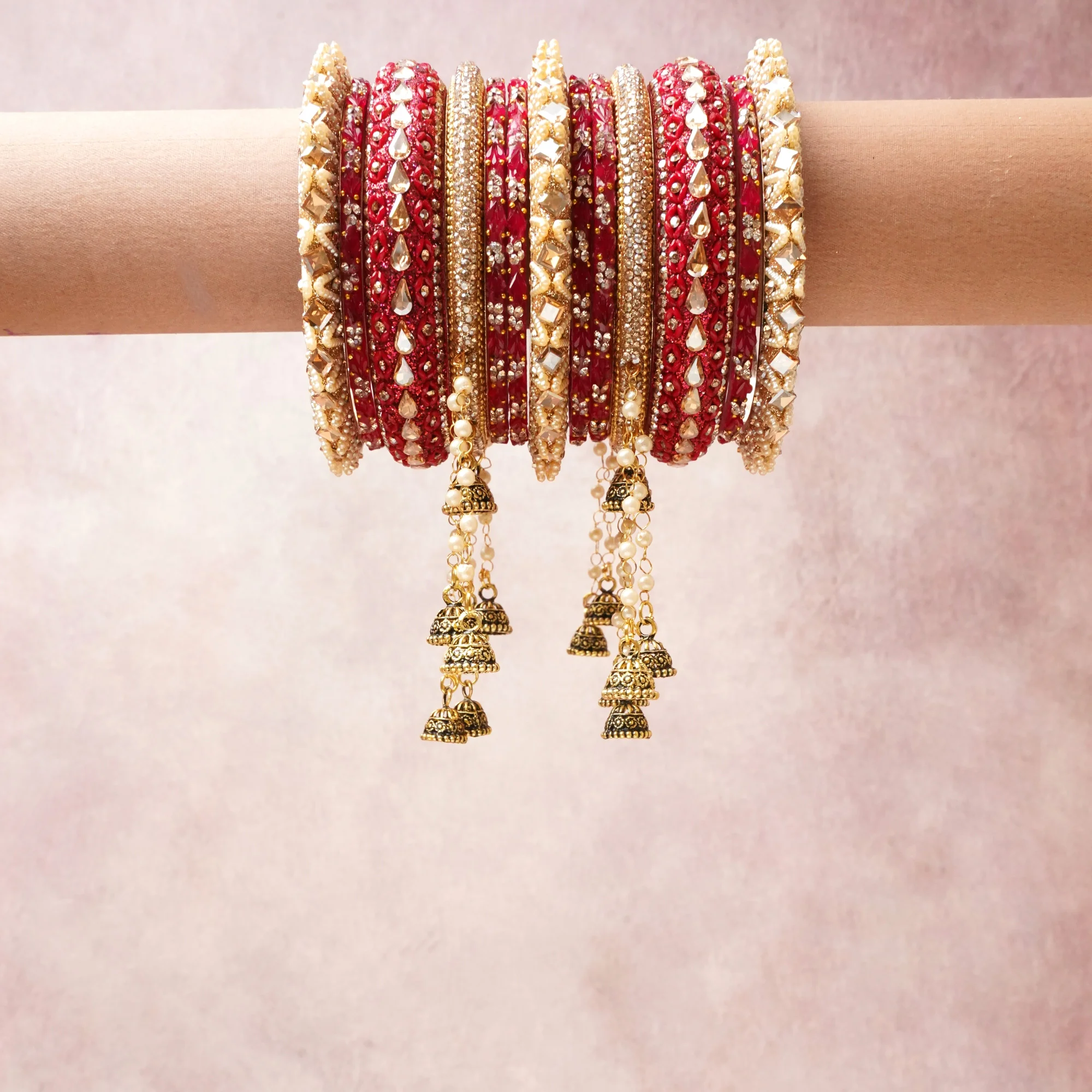 A commanding ruby red anchors this beautiful set, enriched with accents of gold, ivory, crystal that add depth and dimension.

Featuring a striking composition of kundan, gold-tone metal, beads, this set carries intricate craftsmanship and strong presence. Grand in form, it is created for moments that deserve to be marked.