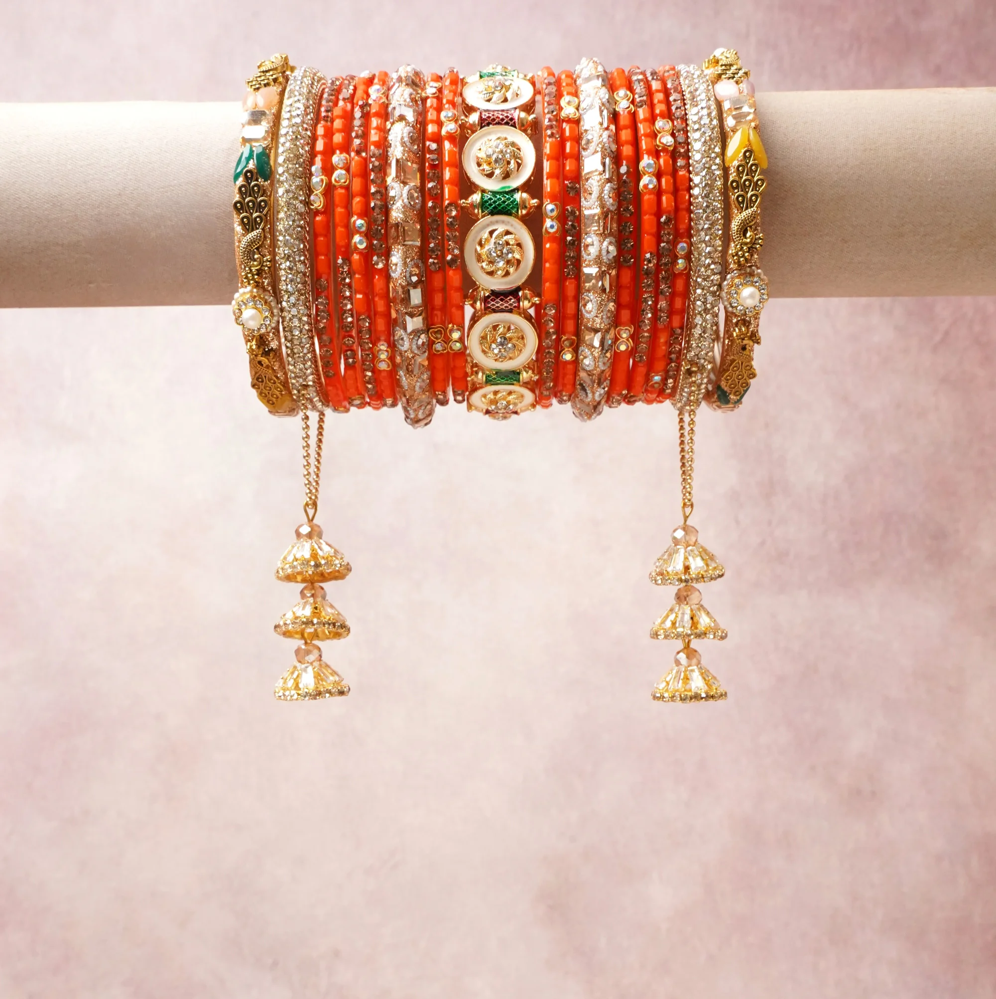 A commanding Coral Orange anchors this beautiful set, enriched with accents of Gold, White, Silver that add depth and dimension.

Featuring a striking composition of Kundan, Glass Beads, Metal, this set carries intricate craftsmanship and strong presence. Grand in form, it is created for moments that deserve to be marked.