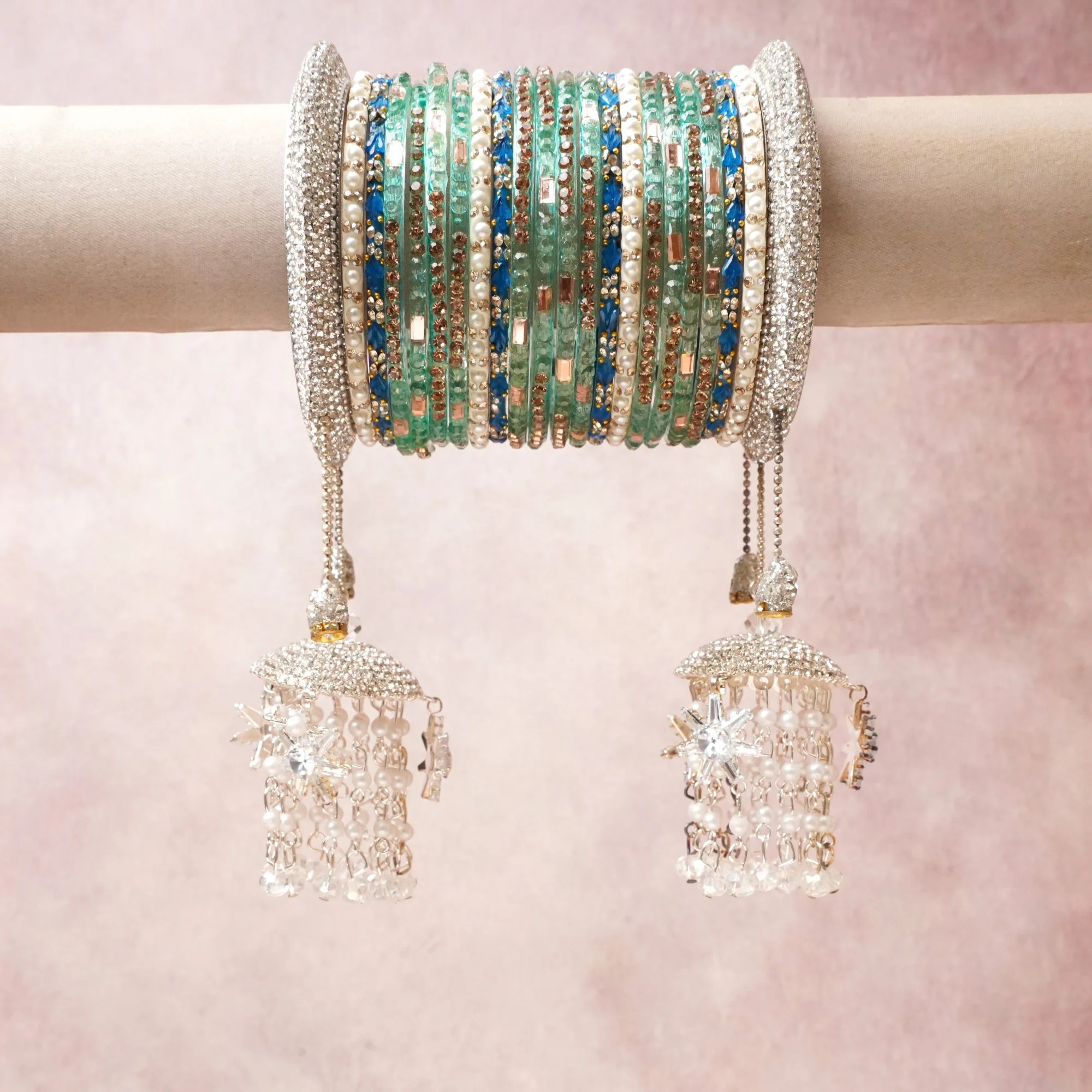 A commanding mint green anchors this beautiful set, enriched with accents of silver, cobalt blue, pearl white that add depth and dimension.

Featuring a striking composition of crystal beading, this set carries intricate craftsmanship and strong presence. Grand in form, it is created for moments that deserve to be marked.