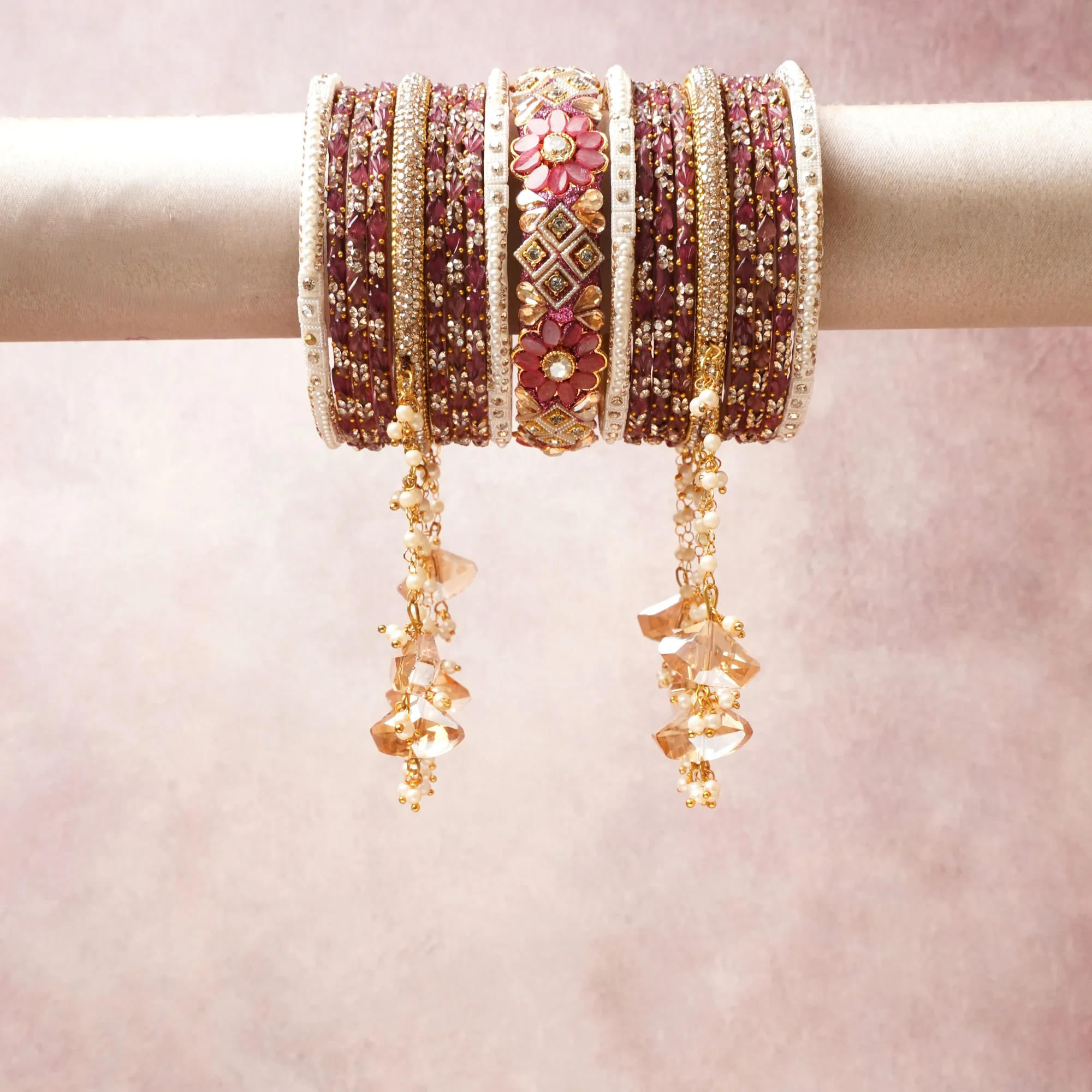 A commanding Burgundy anchors this beautiful set, enriched with accents of Gold, Ivory, Rose Pink that add depth and dimension.

Featuring a striking composition of Fabric, rhinestones, beads, faux pearls, crystal, this set carries intricate craftsmanship and strong presence. Grand in form, it is created for moments that deserve to be marked.