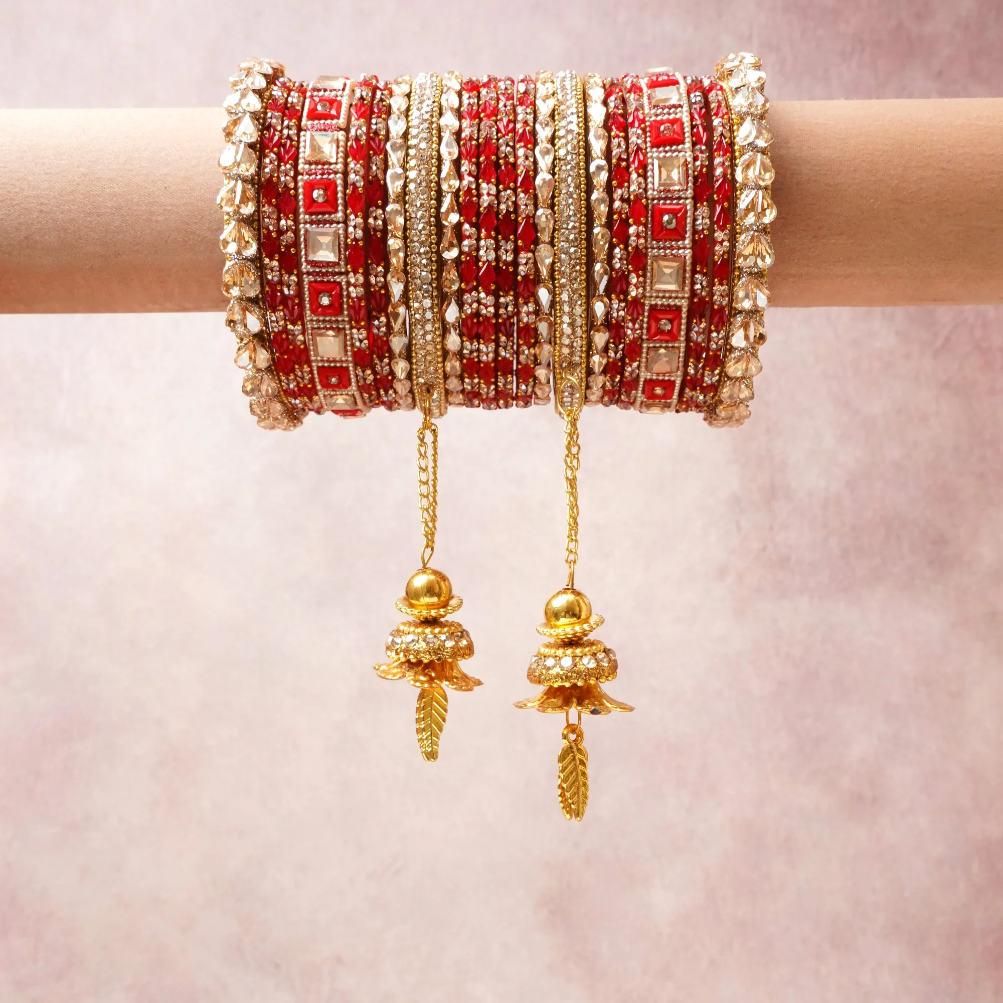 A commanding Red anchors this beautiful set, enriched with accents of Gold, White, Silver that add depth and dimension.

Featuring a striking composition of Kundan, Beaded Fabric, Gold Plated Metal, this set carries intricate craftsmanship and strong presence. Grand in form, it is created for moments that deserve to be marked.