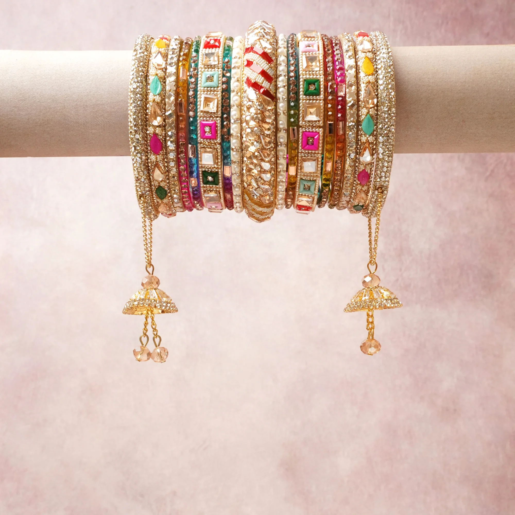 A commanding gold anchors this beautiful set, enriched with accents of white, pink that add depth and dimension.

Featuring a striking composition of metal, crystal stones, enamel, this set carries intricate craftsmanship and strong presence. Grand in form, it is created for moments that deserve to be marked.