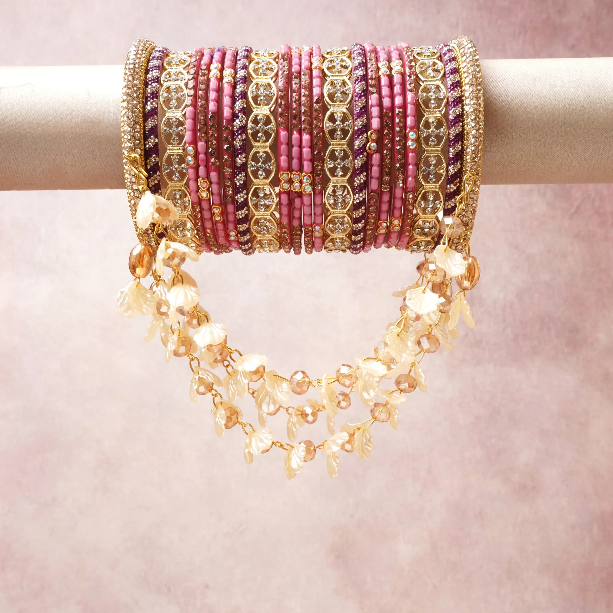 A commanding pink anchors this beautiful set, enriched with accents of gold, ivory, burgundy that add depth and dimension.

Featuring a striking composition of gold-plated metal, beads, rhinestones, this set carries intricate craftsmanship and strong presence. Grand in form, it is created for moments that deserve to be marked.