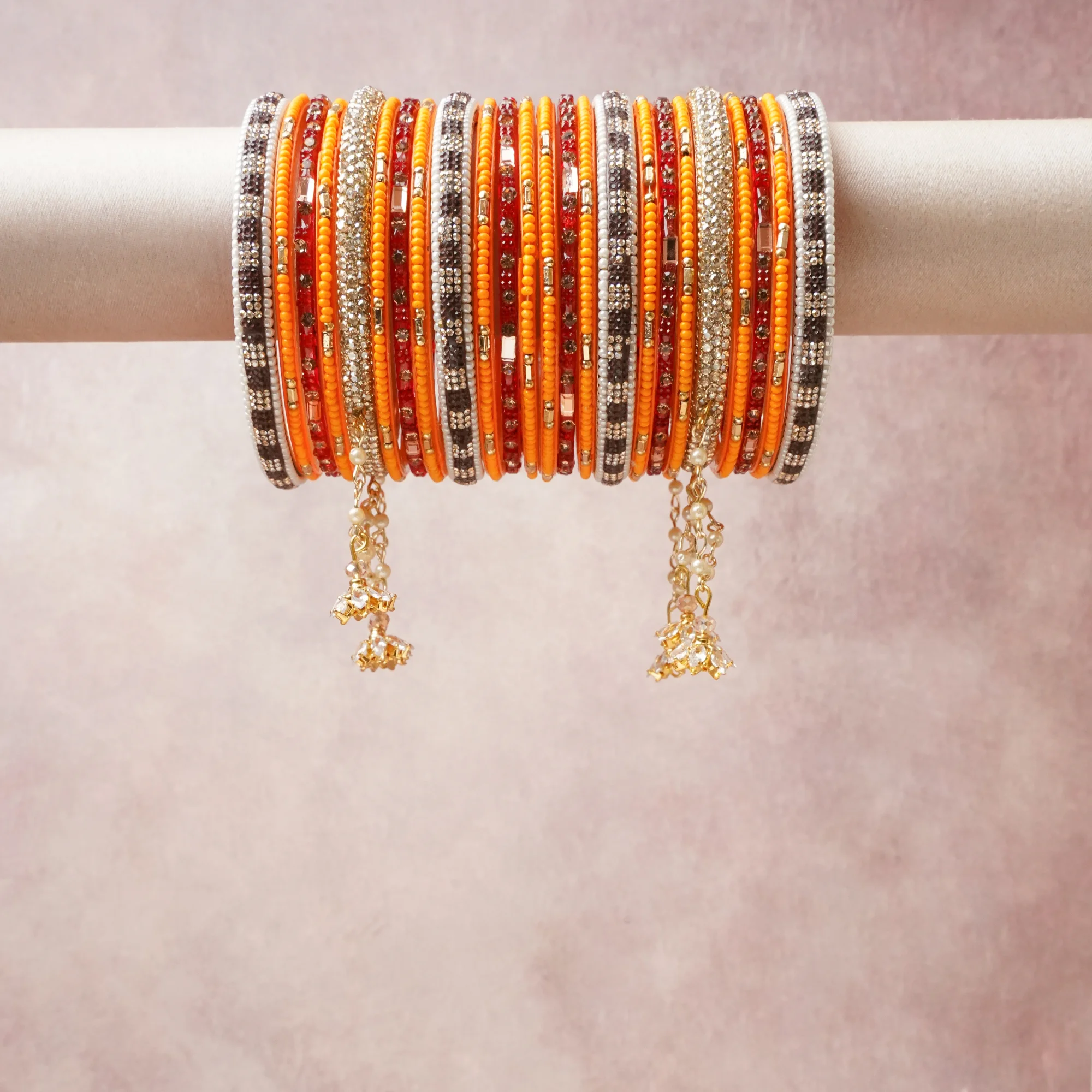 A commanding orange anchors this beautiful set, enriched with accents of silver, gold, red that add depth and dimension.

Featuring a striking composition of glass beads, rhinestones, metal, this set carries intricate craftsmanship and strong presence. Grand in form, it is created for moments that deserve to be marked.