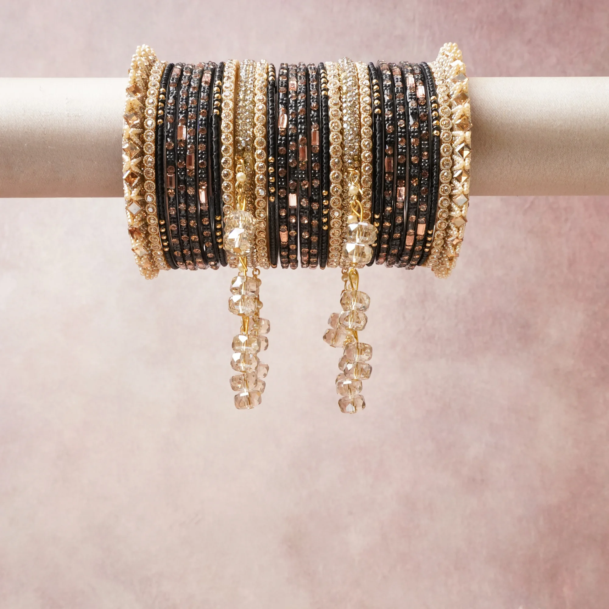 A commanding black anchors this beautiful set, enriched with accents of gold, champagne, clear crystal that add depth and dimension.

Featuring a striking composition of beaded bangles, rhinestone crystals, metal accents, this set carries intricate craftsmanship and strong presence. Grand in form, it is created for moments that deserve to be marked.