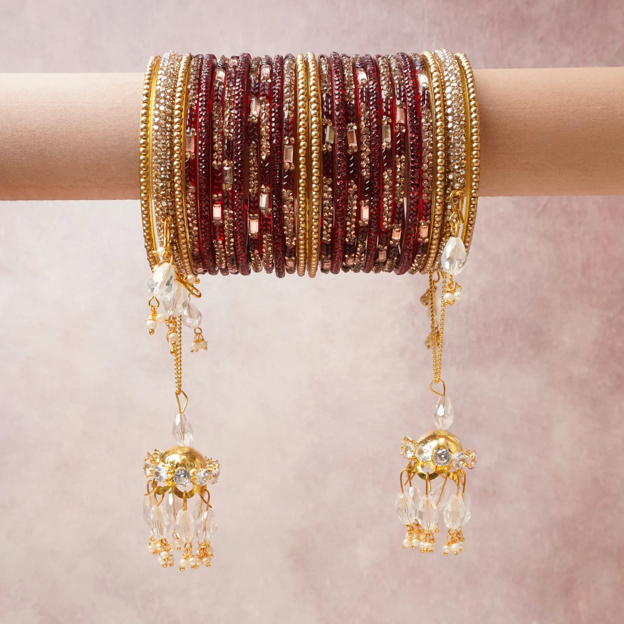 A commanding ruby red anchors this beautiful set, enriched with accents of gold, crystal clear, champagne that add depth and dimension.

Featuring a striking composition of glass beads, crystal beads, gold-tone metal, this set carries intricate craftsmanship and strong presence. Grand in form, it is created for moments that deserve to be marked.