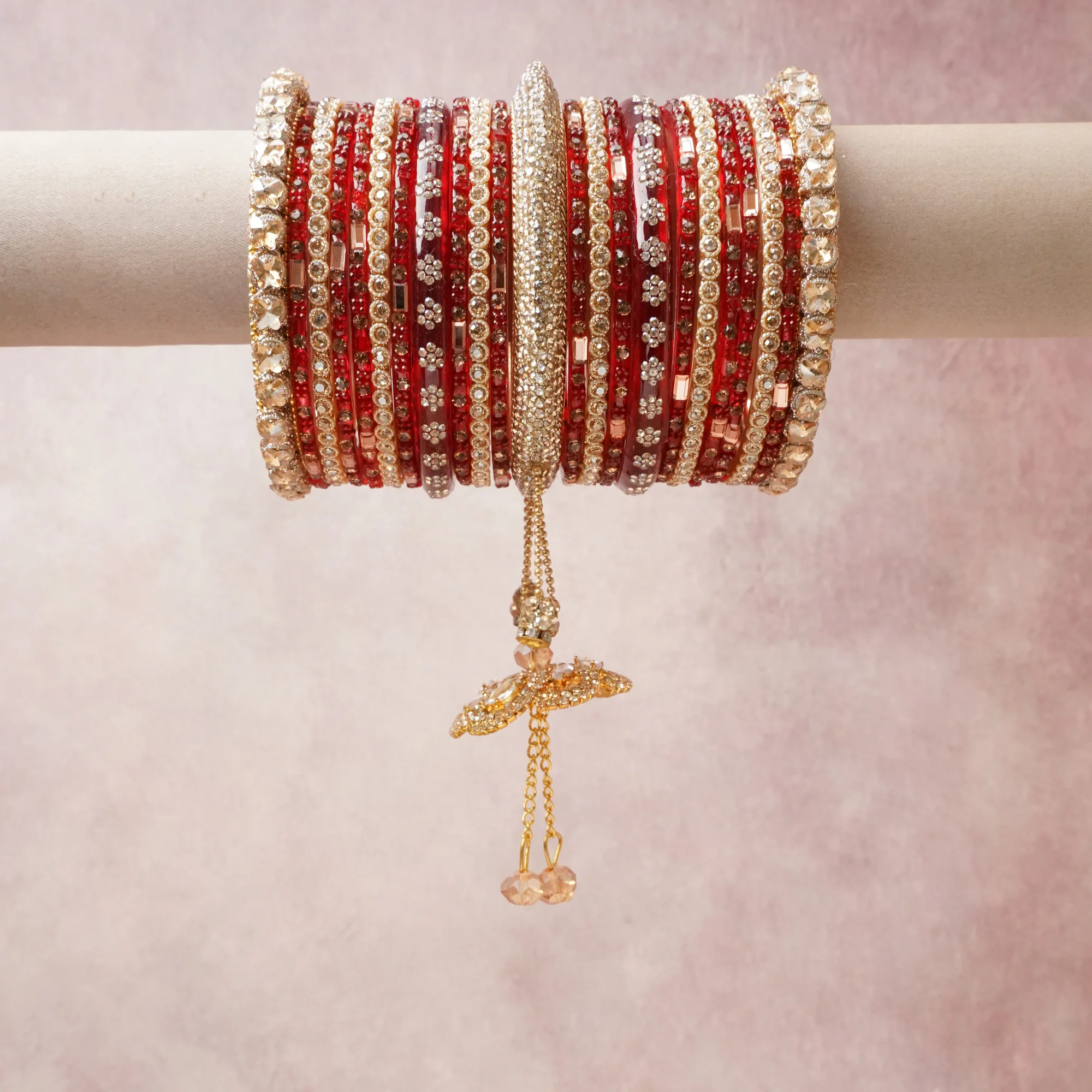 A commanding Red anchors this beautiful set, enriched with accents of Gold, Silver, Crystal that add depth and dimension.

Featuring a striking composition of Kundan, glass, rhinestone, this set carries intricate craftsmanship and strong presence. Grand in form, it is created for moments that deserve to be marked.