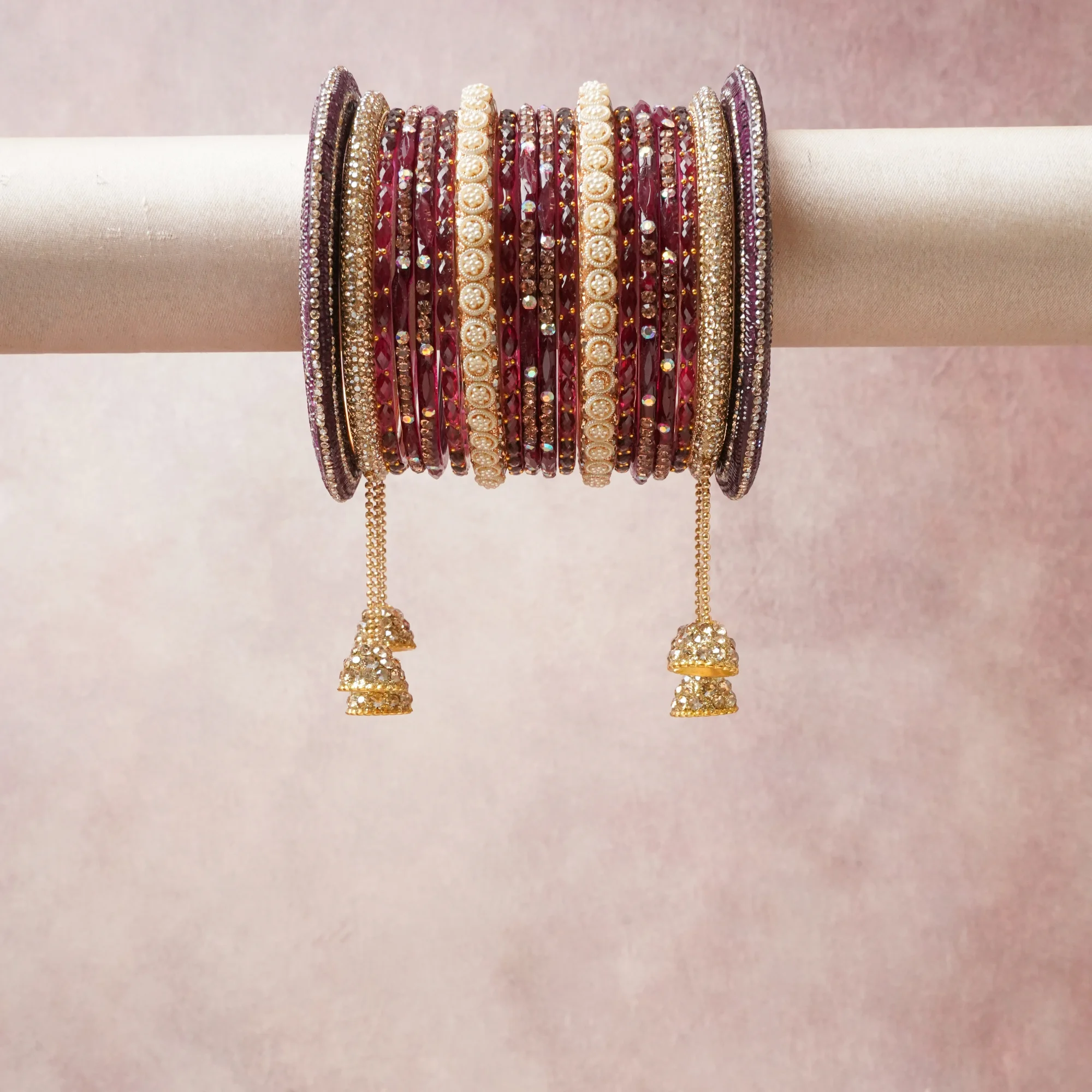 A commanding maroon anchors this beautiful set, enriched with accents of gold, champagne, blush pink that add depth and dimension.

Featuring a striking composition of gold-plated metal, rhinestones, glass beads, this set carries intricate craftsmanship and strong presence. Grand in form, it is created for moments that deserve to be marked.