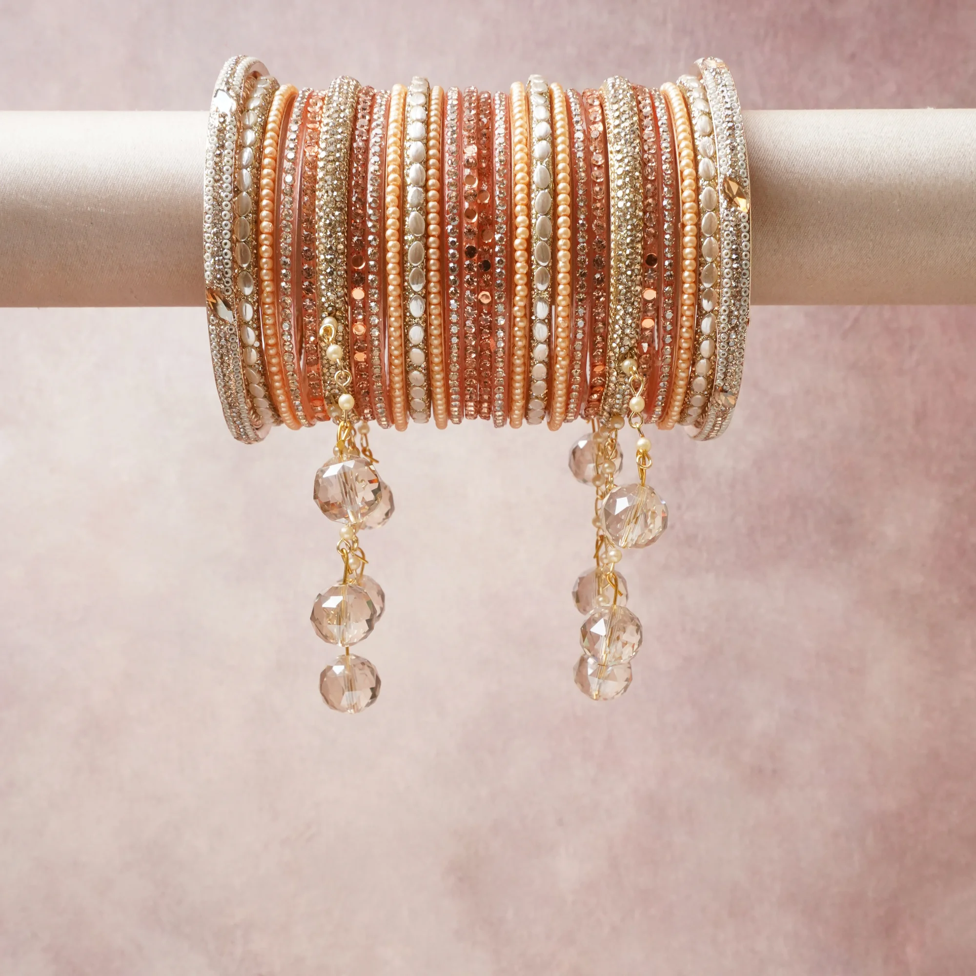 A commanding blush pink anchors this beautiful set, enriched with accents of champagne gold, ivory, crystal clear that add depth and dimension.

Featuring a striking composition of seed beads, rhinestone crystals, faux pearls, faceted glass beads, this set carries intricate craftsmanship and strong presence. Grand in form, it is created for moments that deserve to be marked.