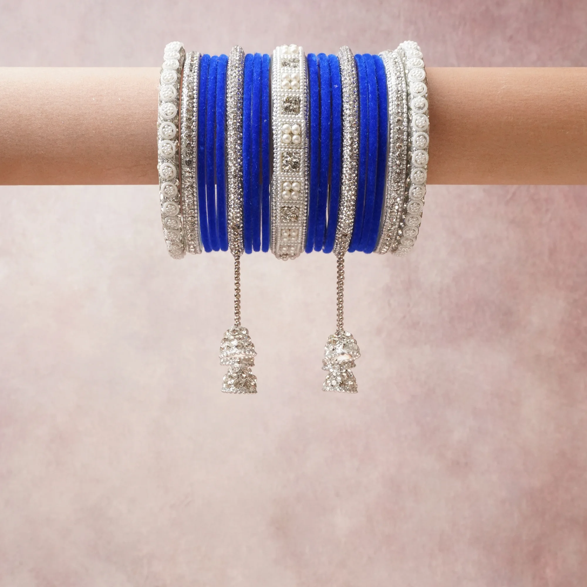A grounding Royal Blue forms the heart of the set, while touches of Silver, White, Crystal add charm.

A thoughtful composition of Glass bangles, faux diamonds, pearl embellishments, designed to feel complete without being heavy.
Each element layers seamlessly, creating a look that is refined, wearable and quietly striking.