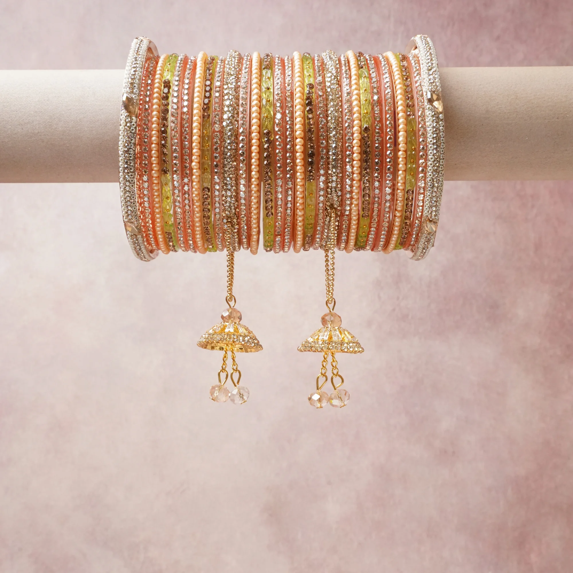 A commanding peach gold anchors this beautiful set, enriched with accents of champagne, crystal clear, ivory white that add depth and dimension.

Featuring a striking composition of kundan, pearls, rhinestones, this set carries intricate craftsmanship and strong presence. Grand in form, it is created for moments that deserve to be marked.
