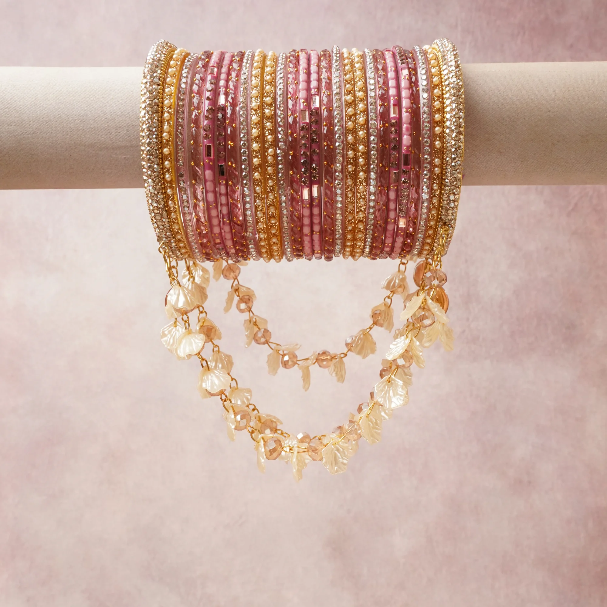 A commanding blush pink anchors this beautiful set, enriched with accents of gold, champagne, ivory that add depth and dimension.

Featuring a striking composition of glass beads, rhinestones, metal, this set carries intricate craftsmanship and strong presence. Grand in form, it is created for moments that deserve to be marked.