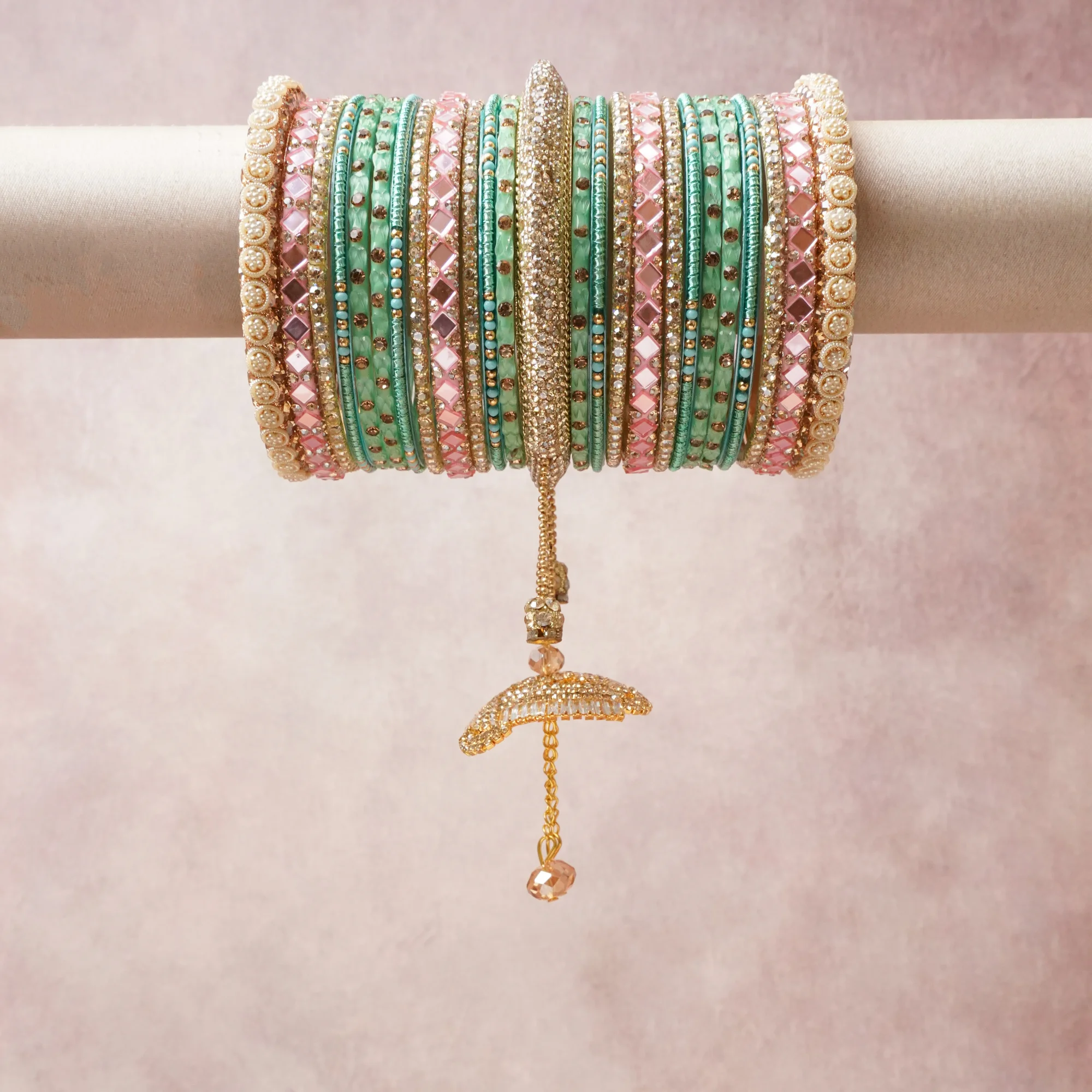 A commanding Mint Green anchors this beautiful set, enriched with accents of Ivory, Blush Pink, Gold that add depth and dimension.

Featuring a striking composition of kundan, rhinestone, enamel, this set carries intricate craftsmanship and strong presence. Grand in form, it is created for moments that deserve to be marked.