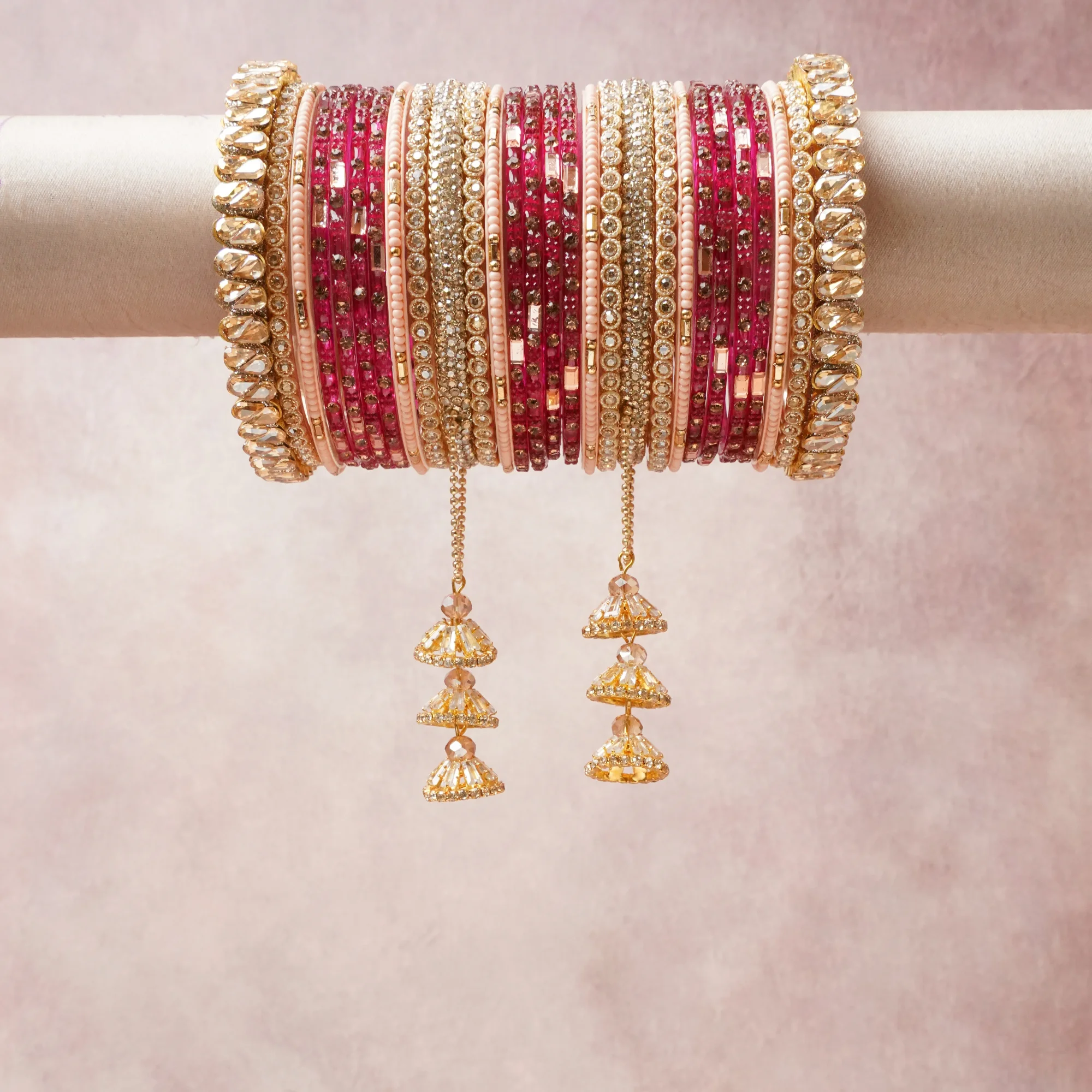 A commanding pink anchors this beautiful set, enriched with accents of gold, champagne, rose that add depth and dimension.

Featuring a striking composition of metal, crystal, rhinestone, this set carries intricate craftsmanship and strong presence. Grand in form, it is created for moments that deserve to be marked.