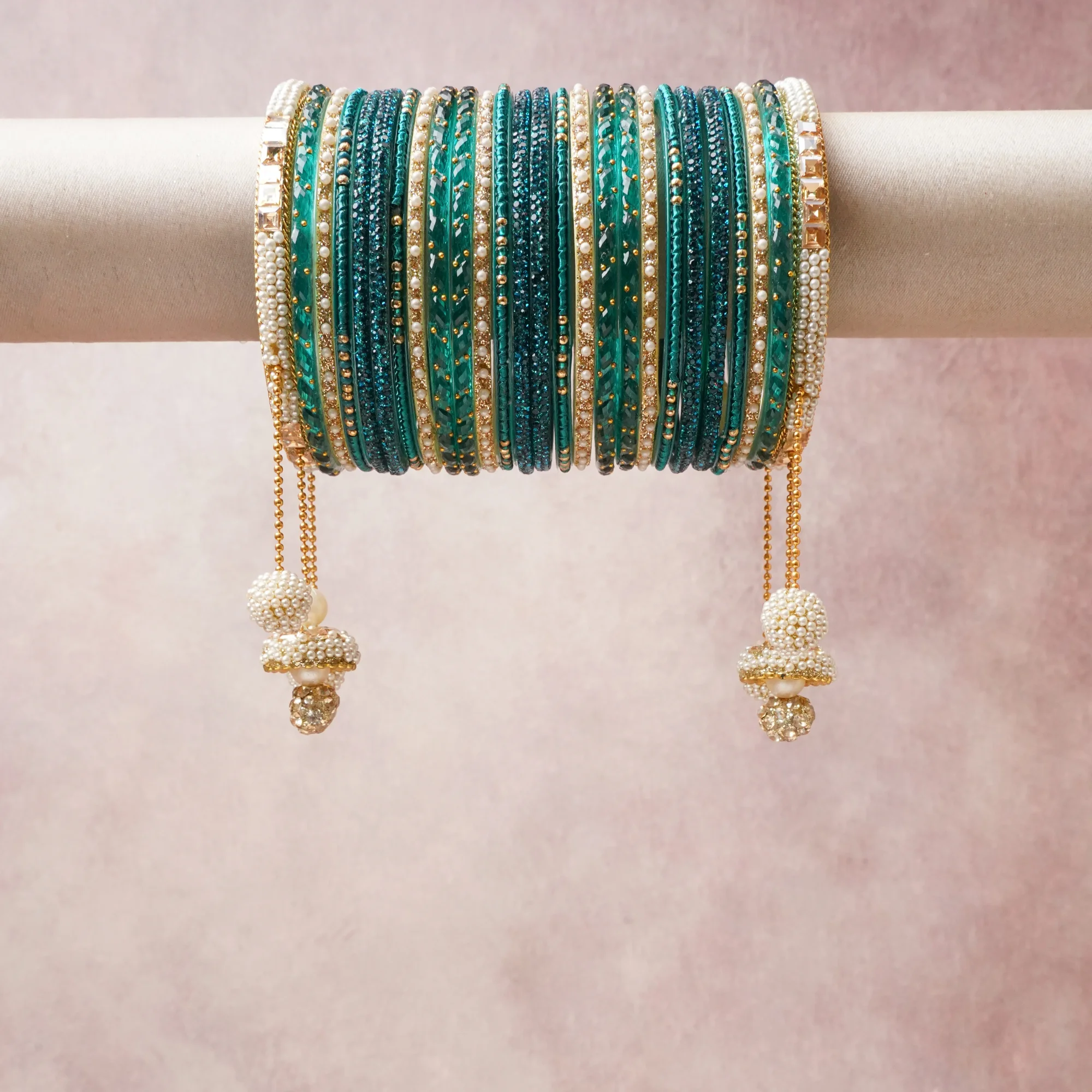 A commanding teal anchors this beautiful set, enriched with accents of gold, ivory, sea green that add depth and dimension.

Featuring a striking composition of silk thread, beads, faux pearls, this set carries intricate craftsmanship and strong presence. Grand in form, it is created for moments that deserve to be marked.