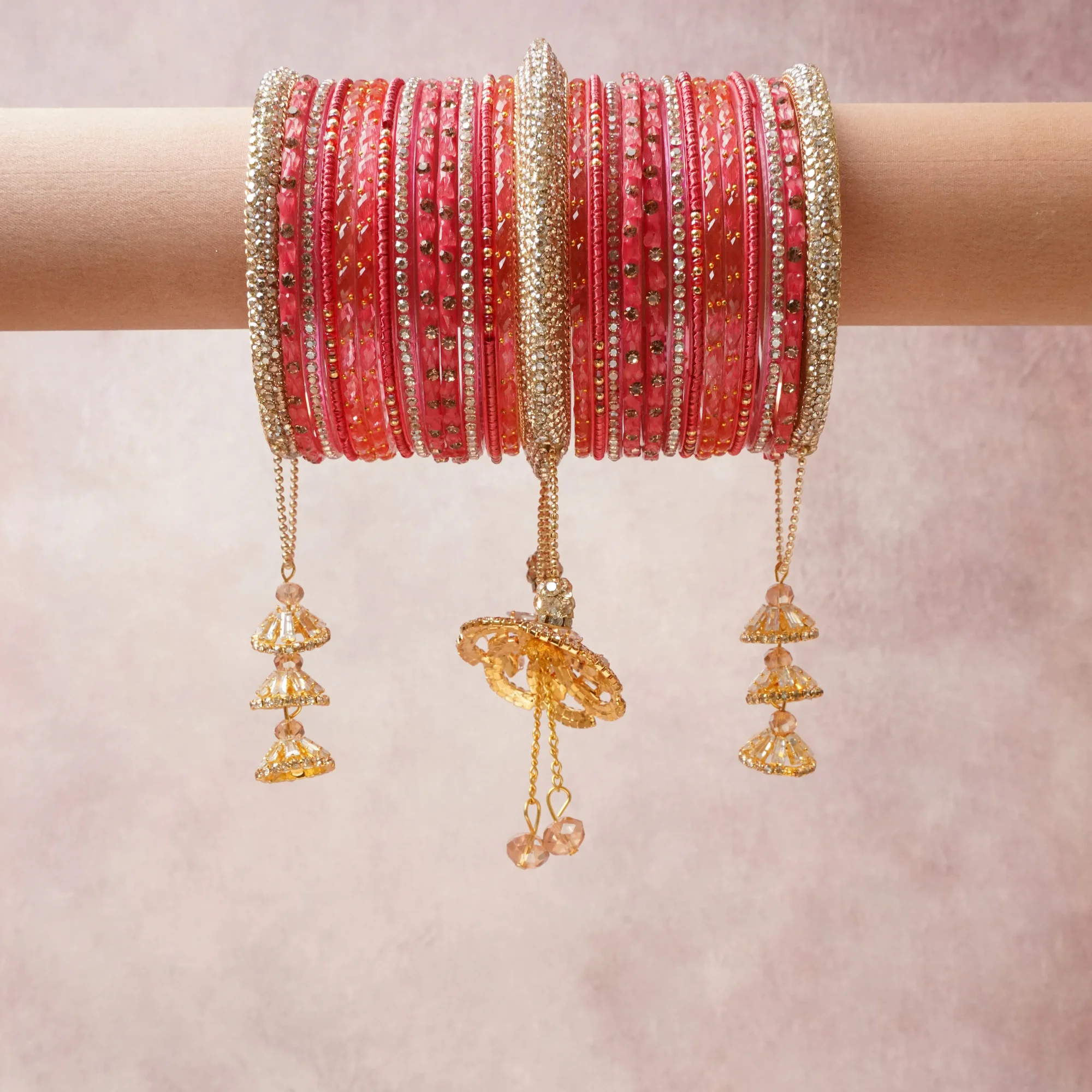 A commanding coral pink anchors this beautiful set, enriched with accents of gold, champagne, rose gold that add depth and dimension.

Featuring a striking composition of crystal, gold-tone metal, glass, this set carries intricate craftsmanship and strong presence. Grand in form, it is created for moments that deserve to be marked.