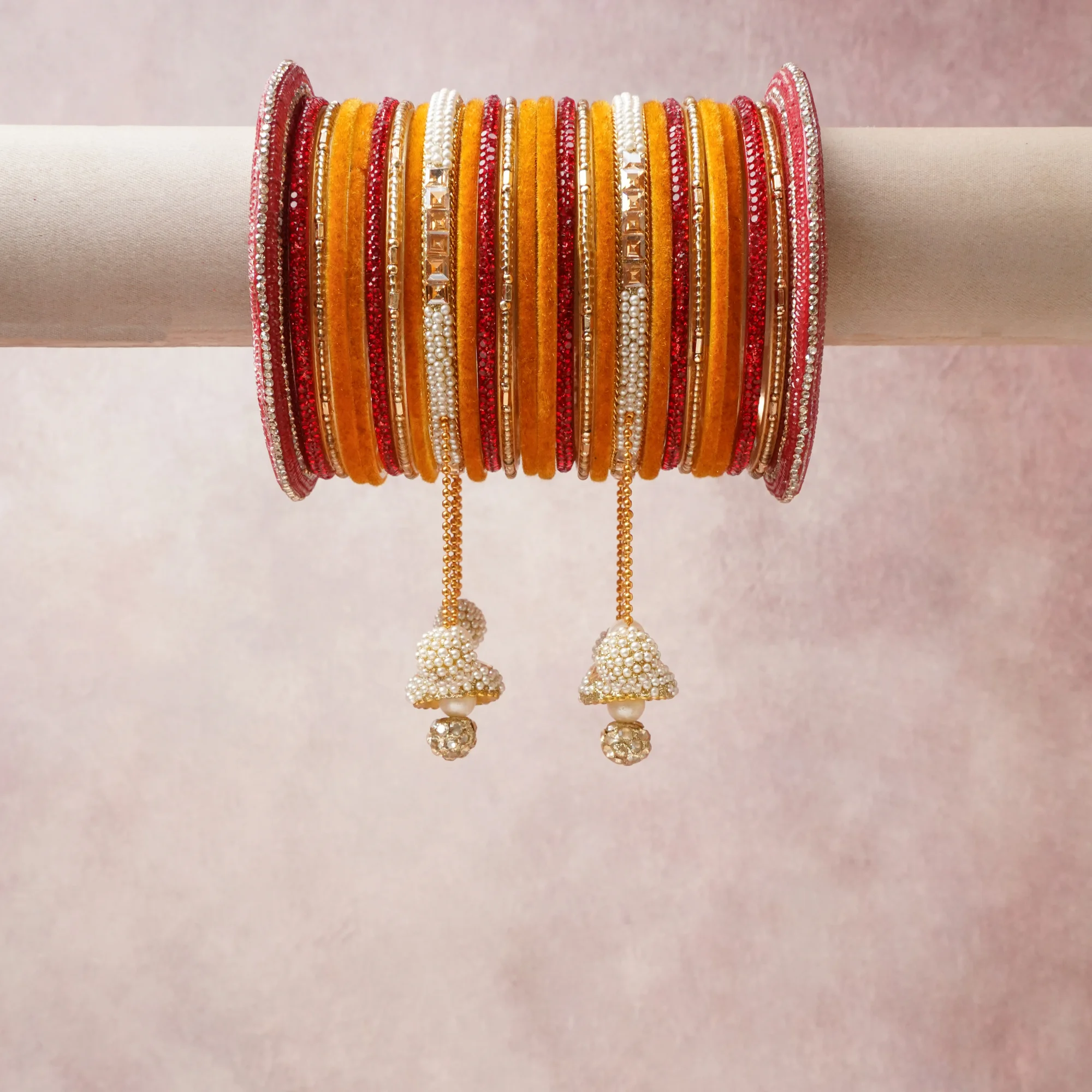 A commanding orange anchors this beautiful set, enriched with accents of red, gold, white that add depth and dimension.

Featuring a striking composition of silk thread, glass beads, pearl beads, metal, this set carries intricate craftsmanship and strong presence. Grand in form, it is created for moments that deserve to be marked.