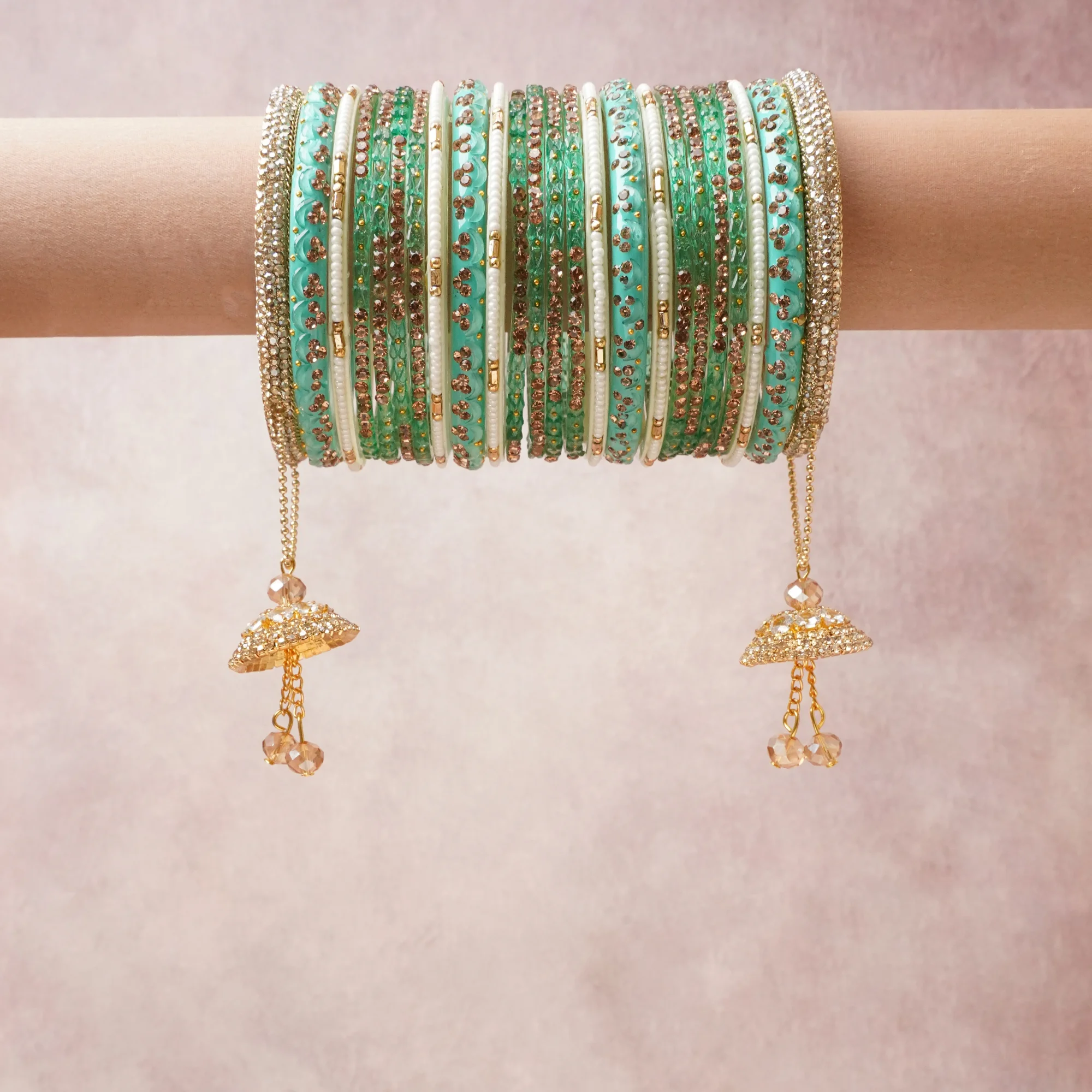 A commanding mint green anchors this beautiful set, enriched with accents of gold, ivory, champagne that add depth and dimension.

Featuring a striking composition of glass beads, gold-tone metal, rhinestones, this set carries intricate craftsmanship and strong presence. Grand in form, it is created for moments that deserve to be marked.