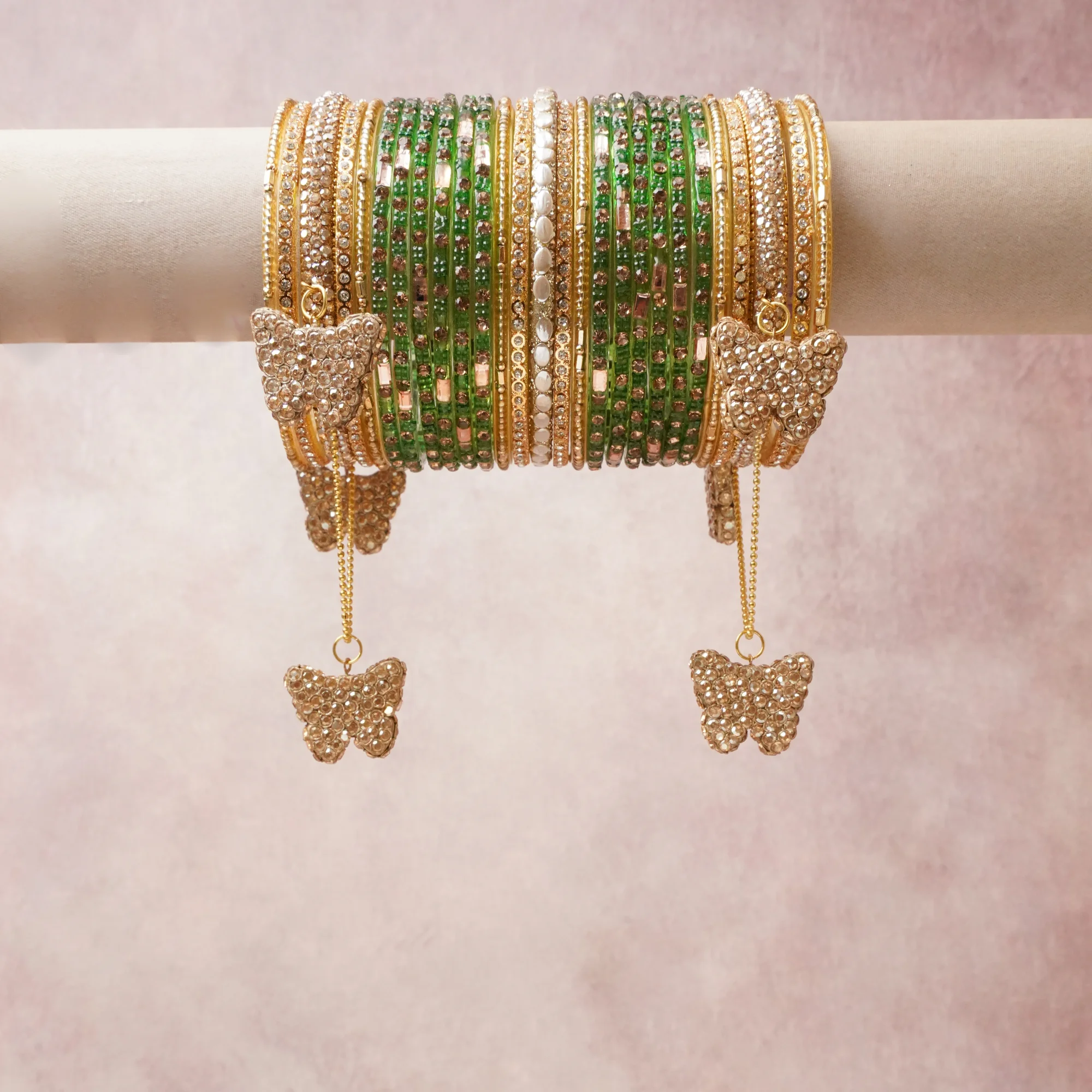 A commanding Green anchors this beautiful set, enriched with accents of Champagne, Gold that add depth and dimension.

Featuring a striking composition of kundan, glass beads, gold-toned metal, this set carries intricate craftsmanship and strong presence. Grand in form, it is created for moments that deserve to be marked.