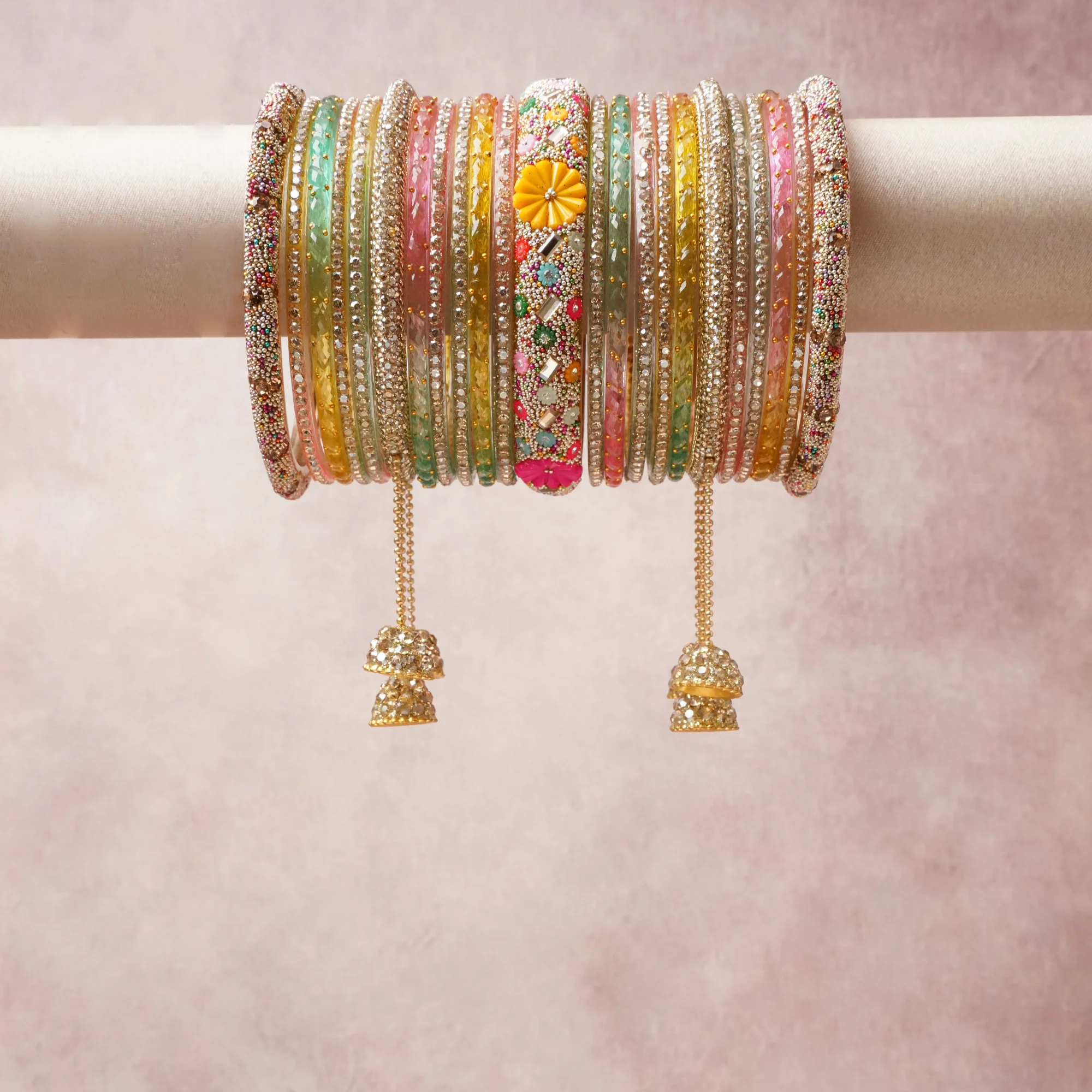A commanding Multi colour anchors this beautiful set, enriched with accents of Gold that add depth and dimension.

Featuring a striking composition of embellished metal bangles, rhinestones, enamel, this set carries intricate craftsmanship and strong presence. Grand in form, it is created for moments that deserve to be marked.