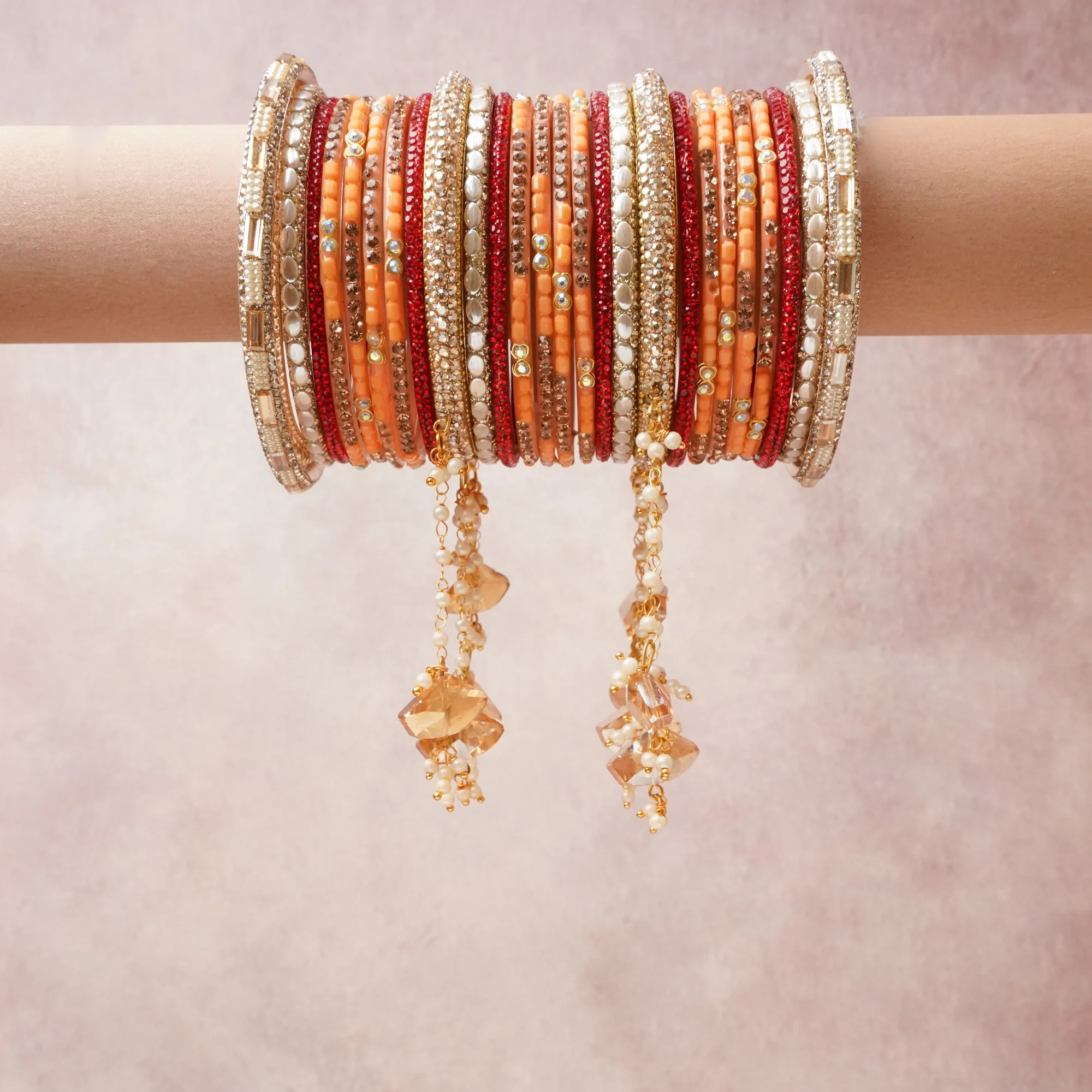 A commanding Peach anchors this beautiful set, enriched with accents of Gold, Ivory, Red that add depth and dimension.

Featuring a striking composition of glass beads, rhinestones, metal, this set carries intricate craftsmanship and strong presence. Grand in form, it is created for moments that deserve to be marked.