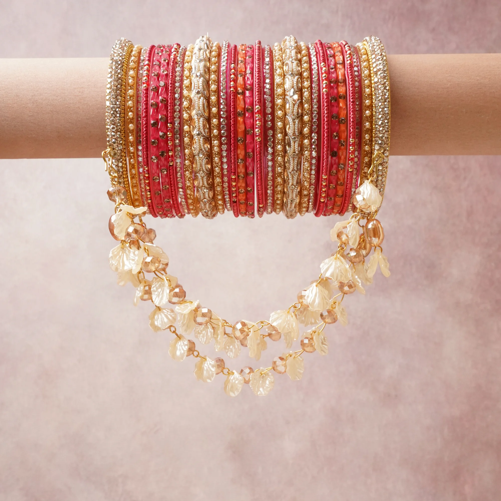 A commanding coral pink anchors this beautiful set, enriched with accents of gold, ivory, champagne that add depth and dimension.

Featuring a striking composition of glass beads, faux pearl, metal, this set carries intricate craftsmanship and strong presence. Grand in form, it is created for moments that deserve to be marked.