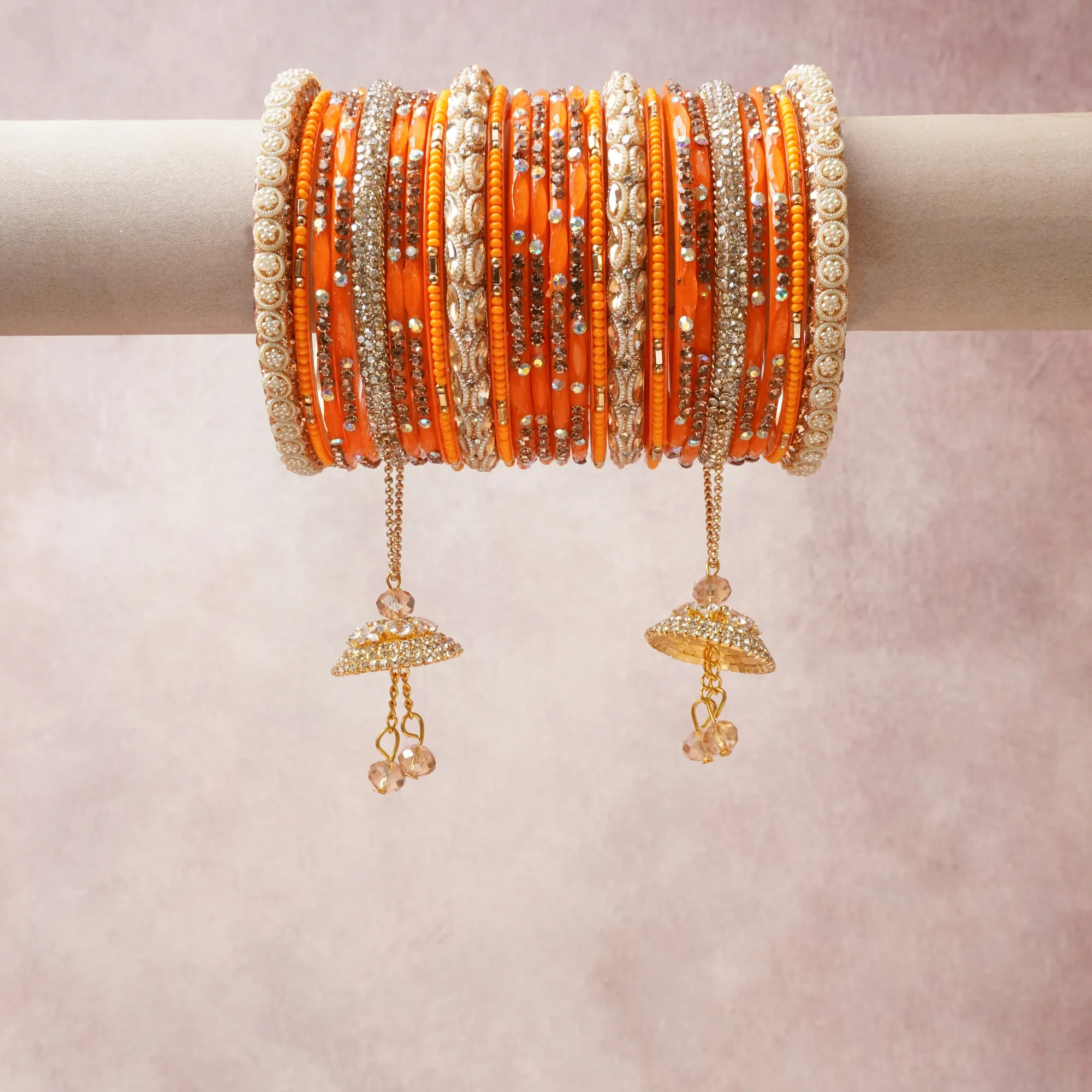 A commanding orange anchors this beautiful set, enriched with accents of gold, ivory, crystal that add depth and dimension.

Featuring a striking composition of glass beads, rhinestones, gold-tone metal, this set carries intricate craftsmanship and strong presence. Grand in form, it is created for moments that deserve to be marked.