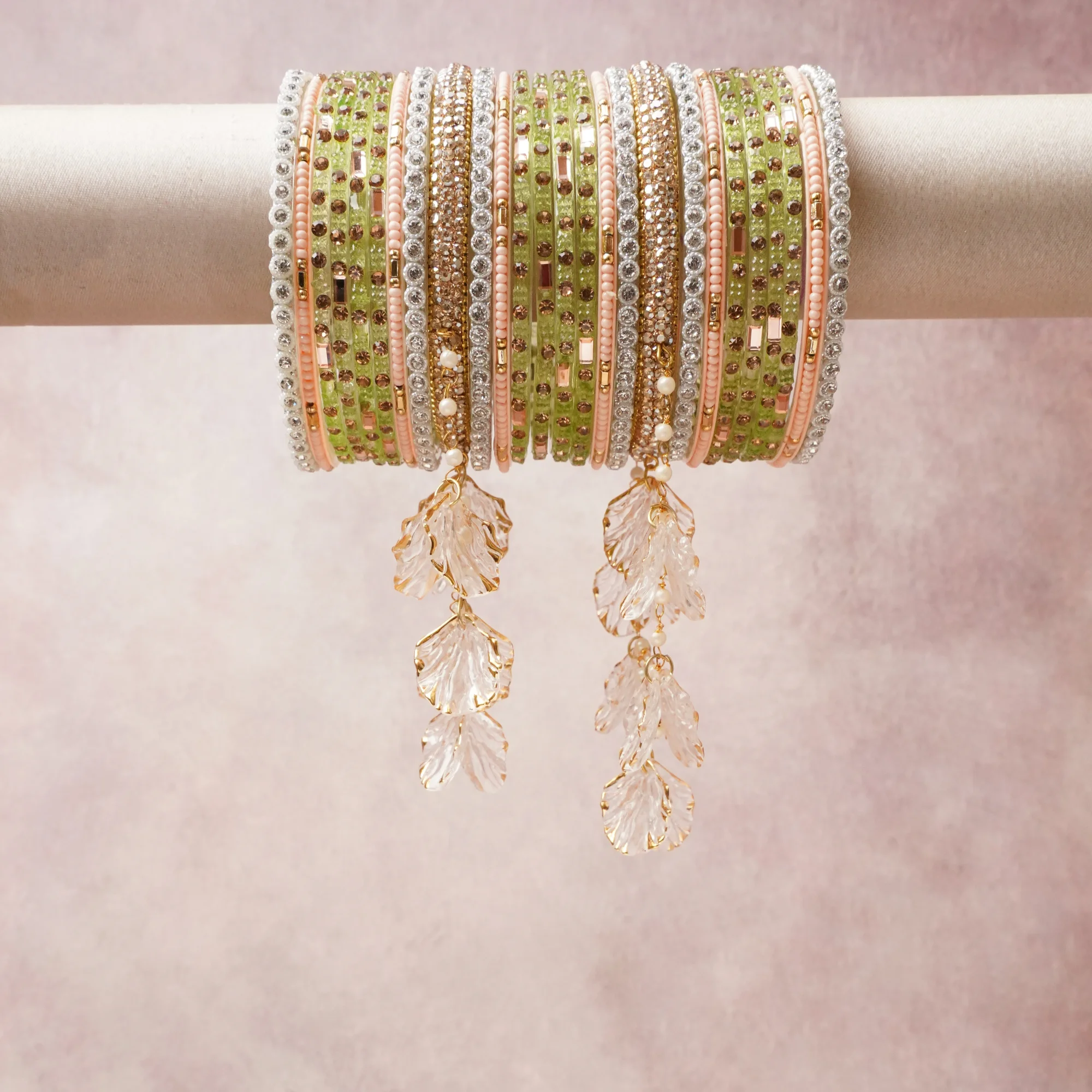 A commanding Lime Green anchors this beautiful set, enriched with accents of Gold, Blush Pink that add depth and dimension.

Featuring a striking composition of crystal, rhinestone, gold-tone metal, acrylic leaf charms, this set carries intricate craftsmanship and strong presence. Grand in form, it is created for moments that deserve to be marked.