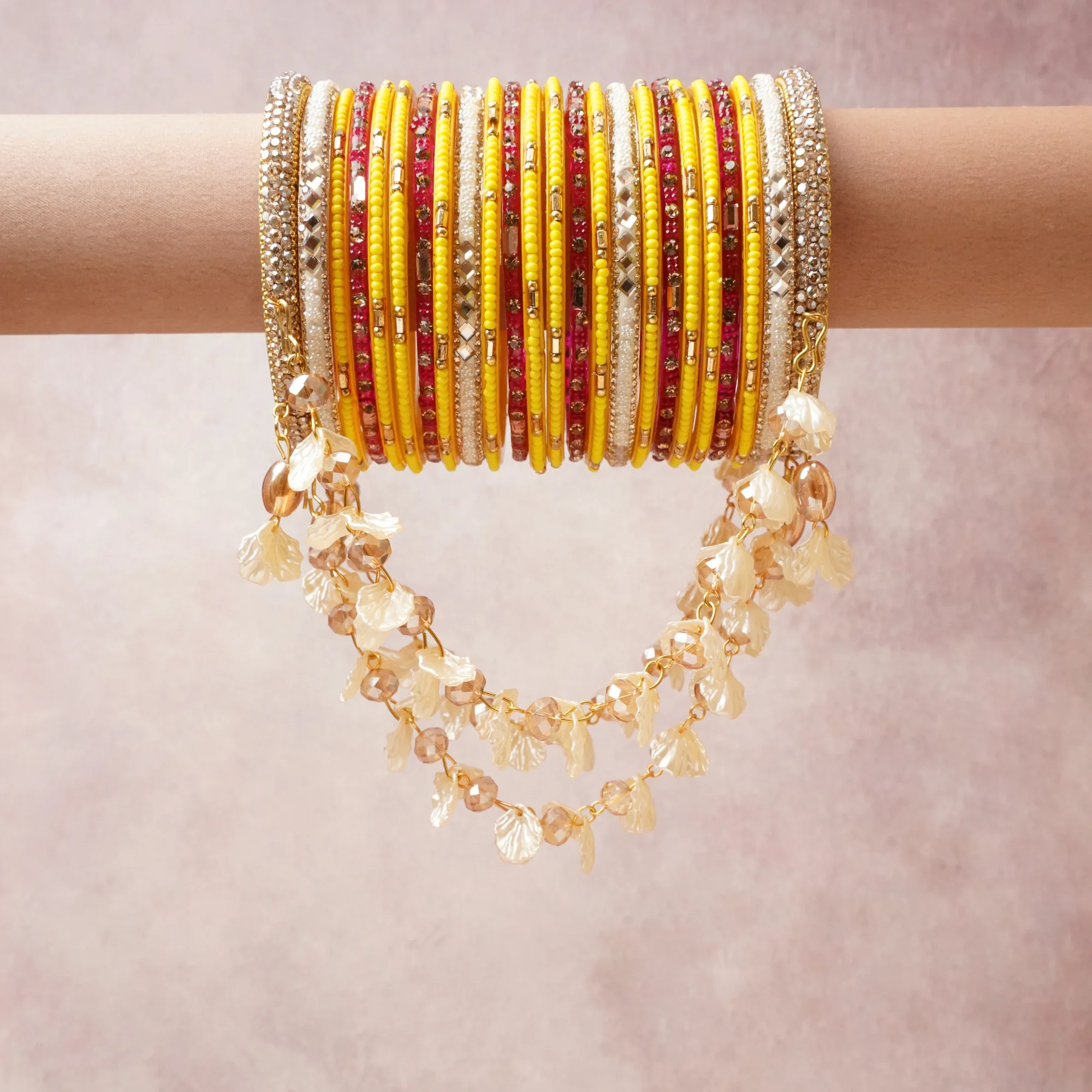 A commanding yellow anchors this beautiful set, enriched with accents of gold, red, white that add depth and dimension.

Featuring a striking composition of glass beads, rhinestones, gold-tone metal, this set carries intricate craftsmanship and strong presence. Grand in form, it is created for moments that deserve to be marked.