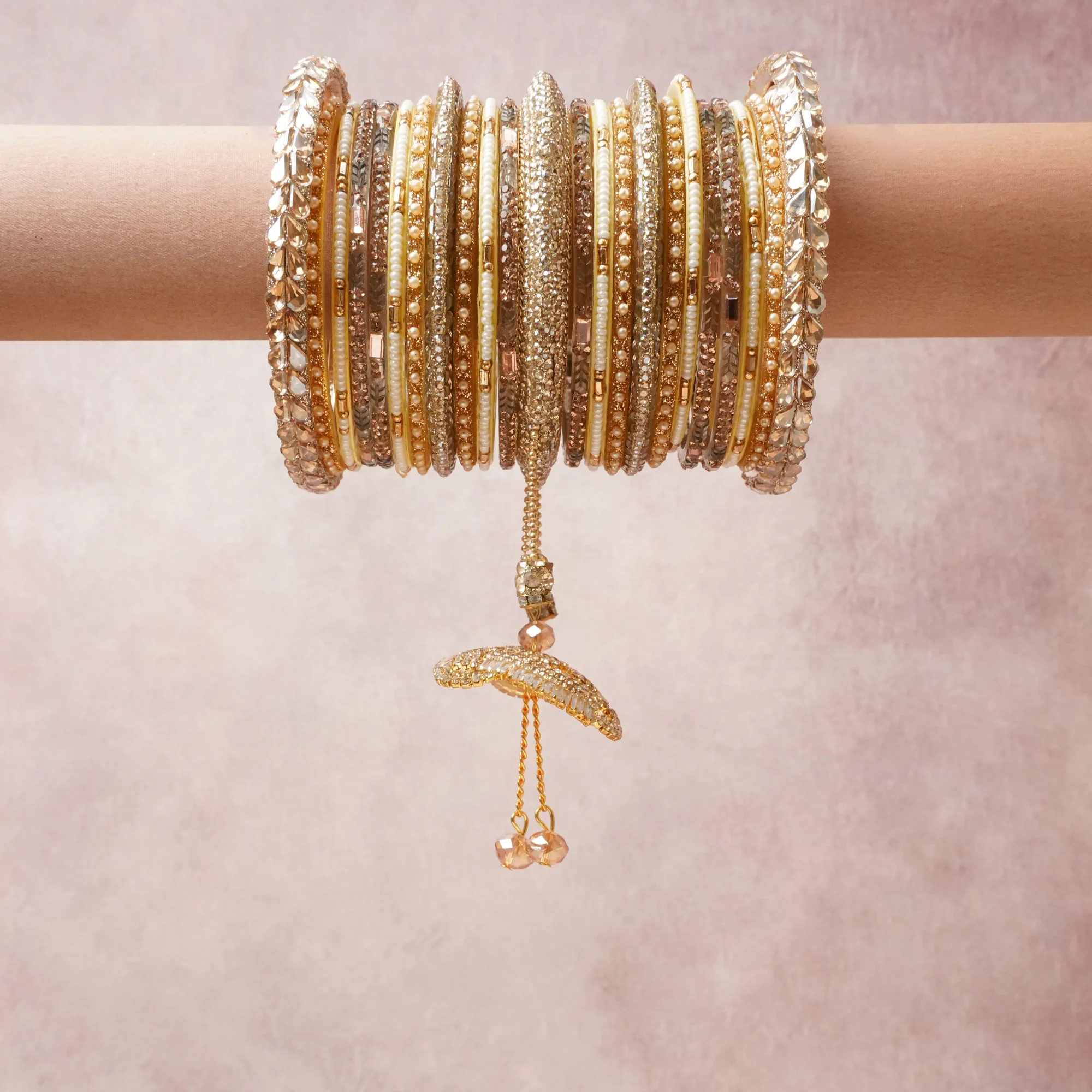 A commanding Gold anchors this beautiful set, enriched with accents of Champagne, Ivory that add depth and dimension.

Featuring a striking composition of metal, rhinestones, pearls, this set carries intricate craftsmanship and strong presence. Grand in form, it is created for moments that deserve to be marked.