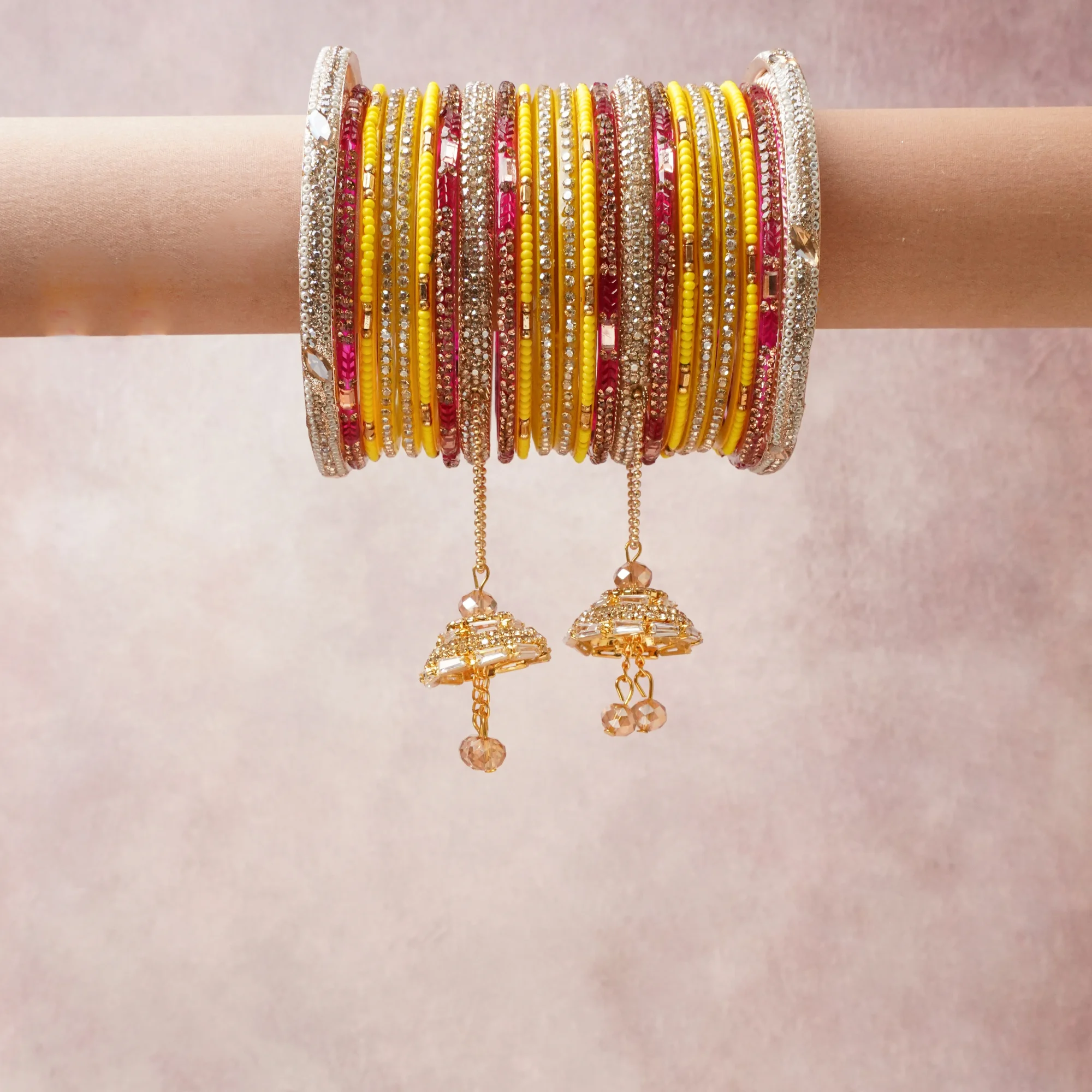 A commanding Yellow Gold anchors this beautiful set, enriched with accents of Champagne Gold, ruby pink that add depth and dimension.

Featuring a striking composition of metal, crystal, bead, this set carries intricate craftsmanship and strong presence. Grand in form, it is created for moments that deserve to be marked.