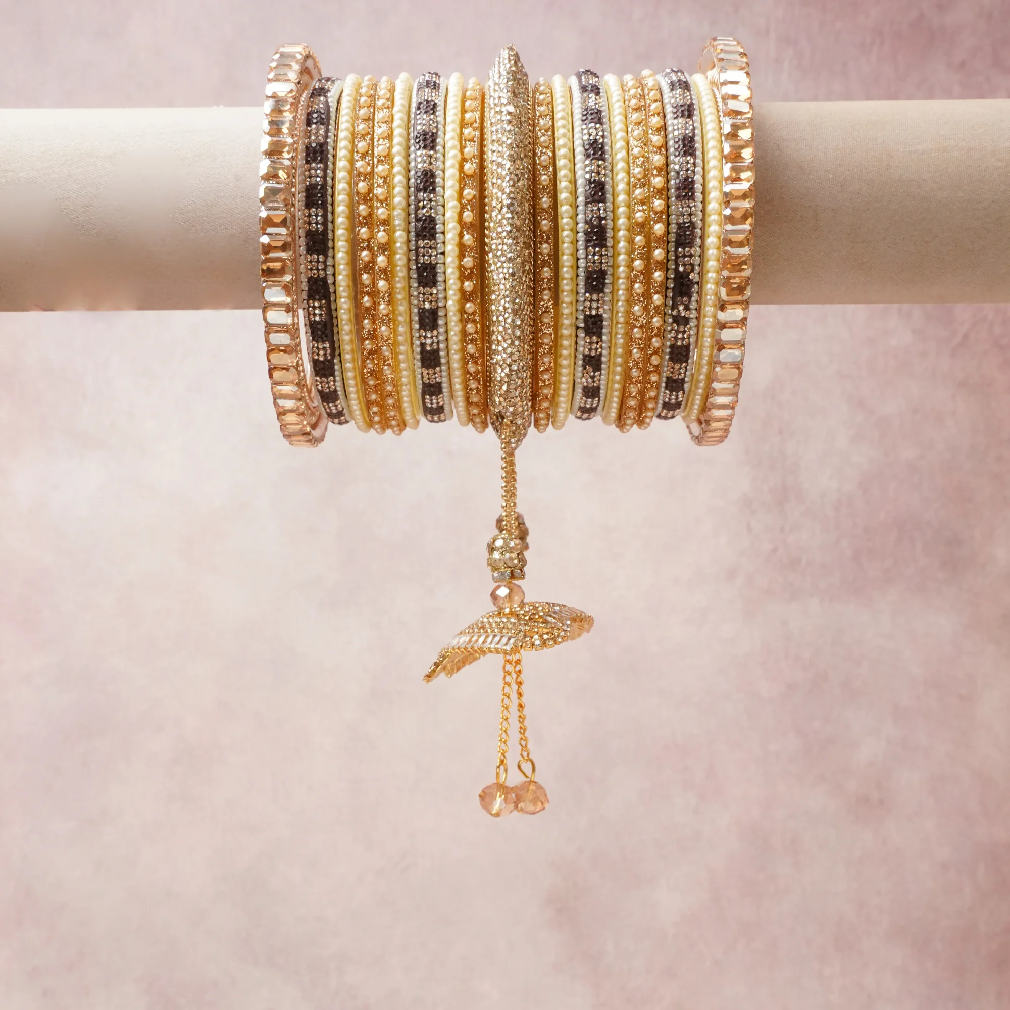 A commanding Gold anchors this beautiful set, enriched with accents of Champagne, Ivory that add depth and dimension.

Featuring a striking composition of Gold-plated metal, rhinestones, faux pearls, this set carries intricate craftsmanship and strong presence. Grand in form, it is created for moments that deserve to be marked.