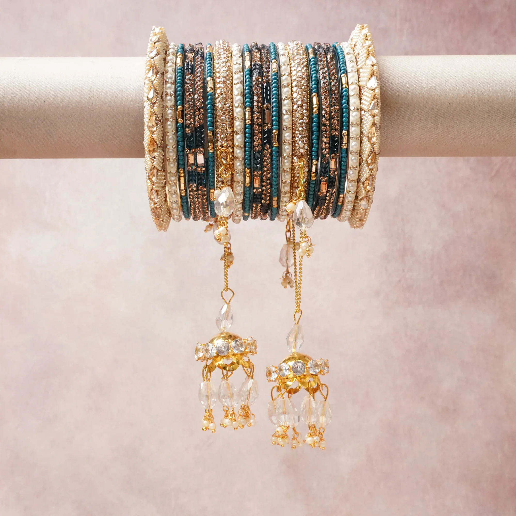 A commanding Teal anchors this beautiful set, enriched with accents of Ivory, Gold that add depth and dimension.

Featuring a striking composition of beaded metal, pearls, crystal, this set carries intricate craftsmanship and strong presence. Grand in form, it is created for moments that deserve to be marked.