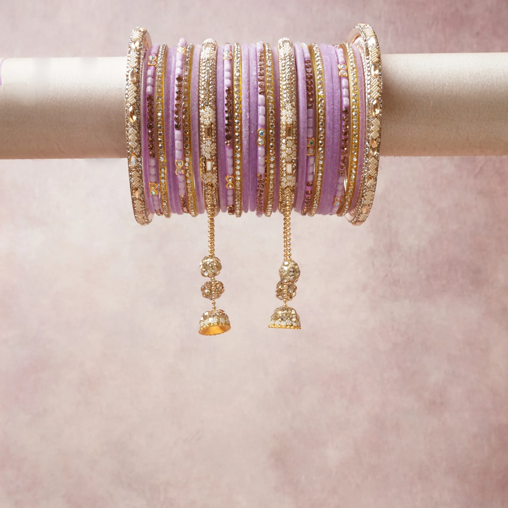 A commanding lavender anchors this beautiful set, enriched with accents of gold, champagne, blush pink that add depth and dimension.

Featuring a striking composition of crystal-studded metal, this set carries intricate craftsmanship and strong presence. Grand in form, it is created for moments that deserve to be marked.