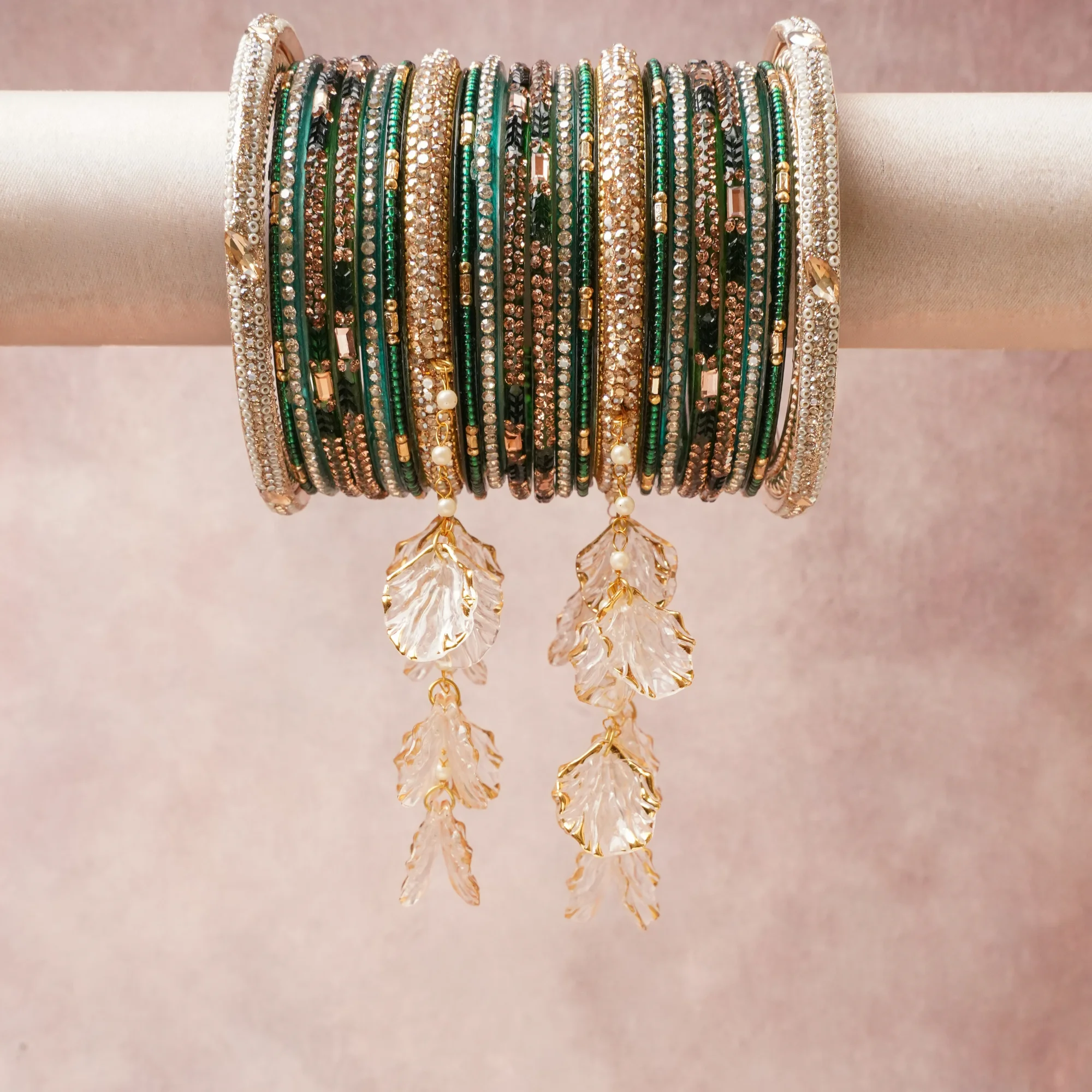 A commanding emerald green anchors this beautiful set, enriched with accents of gold, champagne that add depth and dimension.

Featuring a striking composition of rhinestone, gold-tone metal, acrylic leaf charms, this set carries intricate craftsmanship and strong presence. Grand in form, it is created for moments that deserve to be marked.