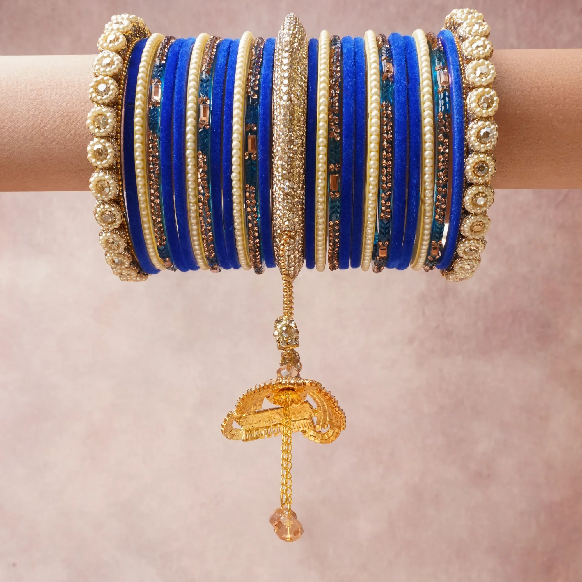 A commanding Royal Blue anchors this beautiful set, enriched with accents of Gold, Champagne, Ivory that add depth and dimension.

Featuring a striking composition of velvet, gold-tone metal, crystal rhinestones, this set carries intricate craftsmanship and strong presence. Grand in form, it is created for moments that deserve to be marked.