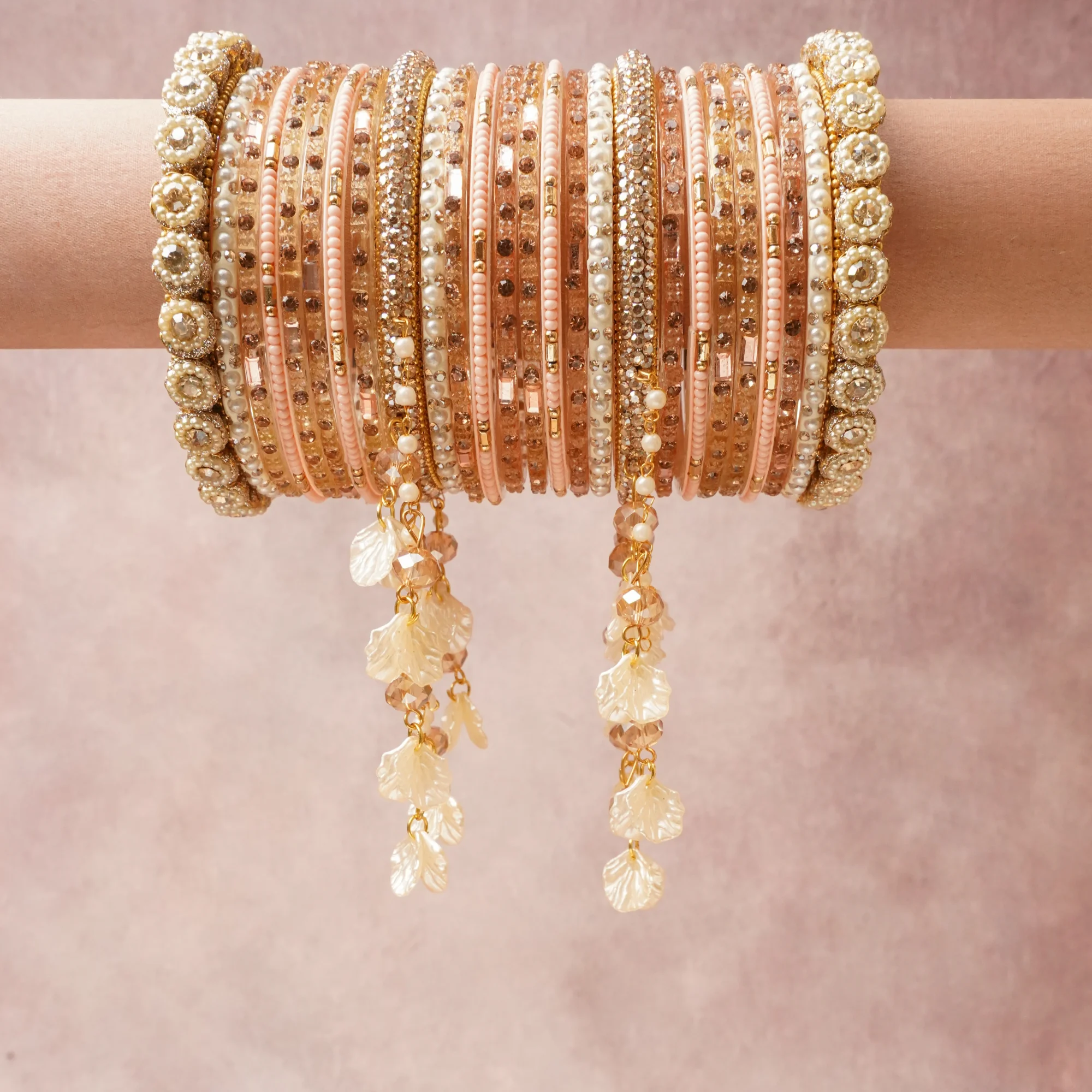 A commanding blush pink anchors this beautiful set, enriched with accents of gold, ivory that add depth and dimension.

Featuring a striking composition of metal, pearls, crystals, this set carries intricate craftsmanship and strong presence. Grand in form, it is created for moments that deserve to be marked.