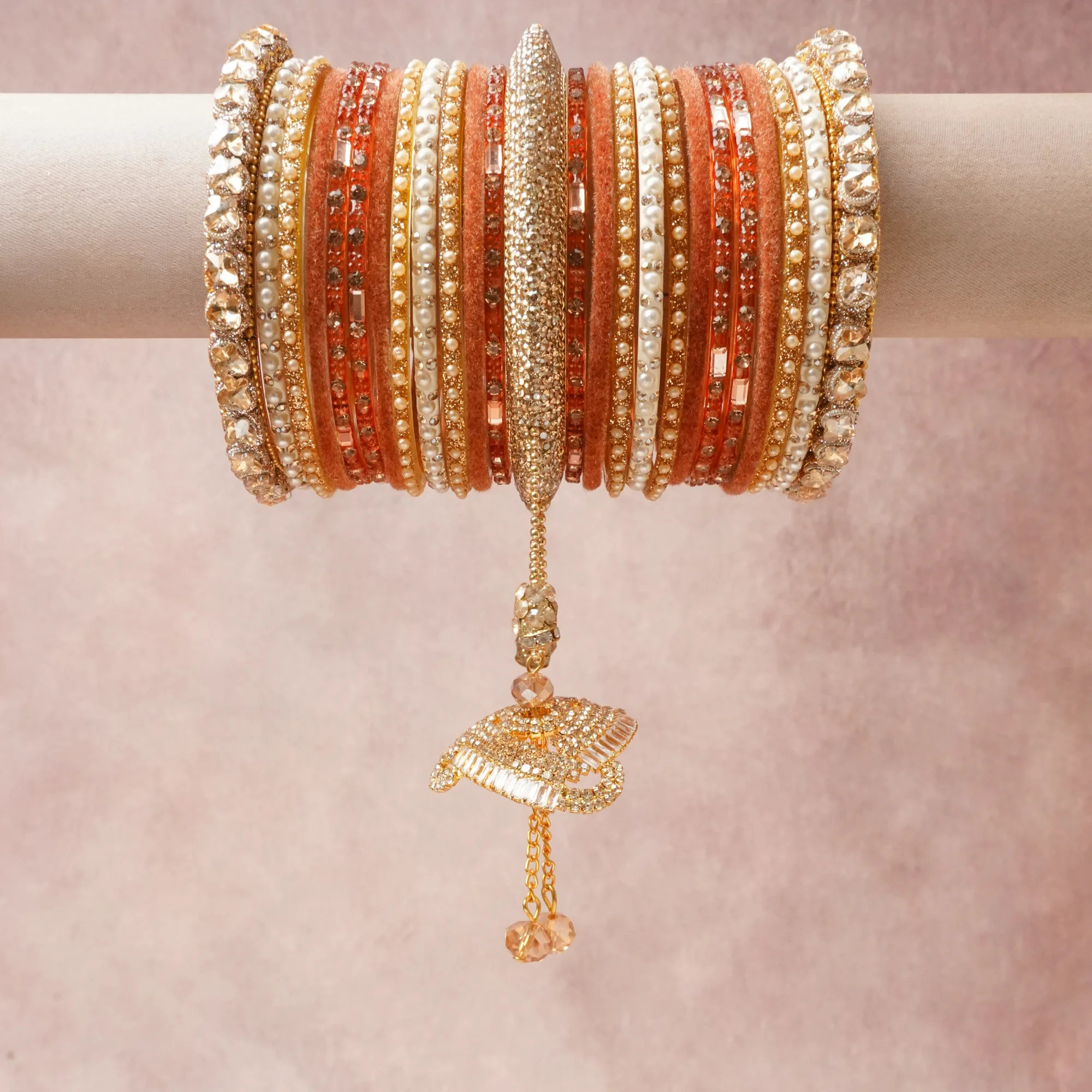 A commanding peach coral anchors this beautiful set, enriched with accents of gold, ivory, champagne that add depth and dimension.

Featuring a striking composition of crystal, pearl, gold-tone metal, this set carries intricate craftsmanship and strong presence. Grand in form, it is created for moments that deserve to be marked.