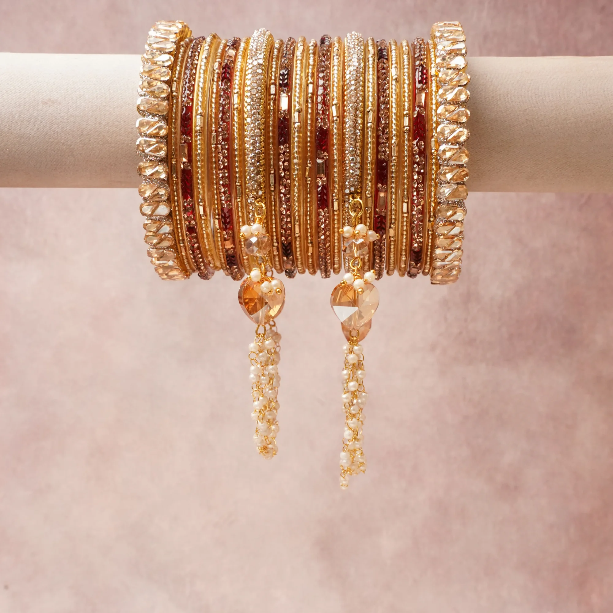 A commanding gold anchors this beautiful set, enriched with accents of champagne, ruby red, crystal clear that add depth and dimension.

Featuring a striking composition of gold-plated metal, rhinestones, crystal beads, pearl beads, this set carries intricate craftsmanship and strong presence. Grand in form, it is created for moments that deserve to be marked.