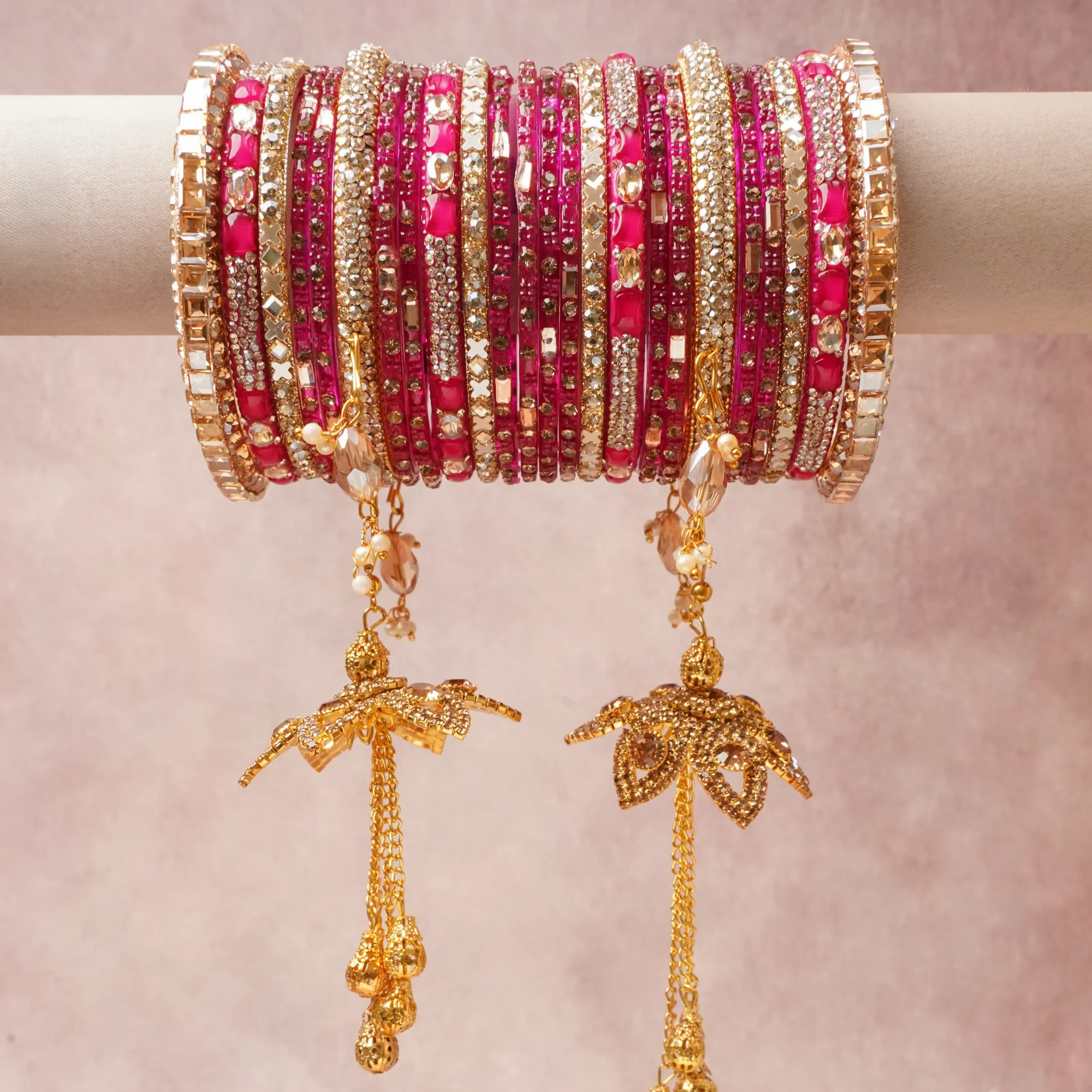A commanding hot pink anchors this beautiful set, enriched with accents of gold, champagne, clear that add depth and dimension.

Featuring a striking composition of gold-tone metal, rhinestones, crystal beads, this set carries intricate craftsmanship and strong presence. Grand in form, it is created for moments that deserve to be marked.