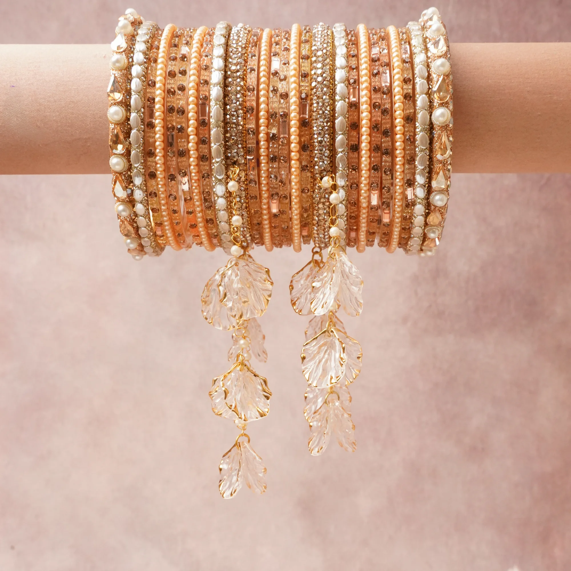 A commanding rose gold anchors this beautiful set, enriched with accents of ivory, champagne, clear that add depth and dimension.

Featuring a striking composition of metal, pearl, crystal, glass, this set carries intricate craftsmanship and strong presence. Grand in form, it is created for moments that deserve to be marked.