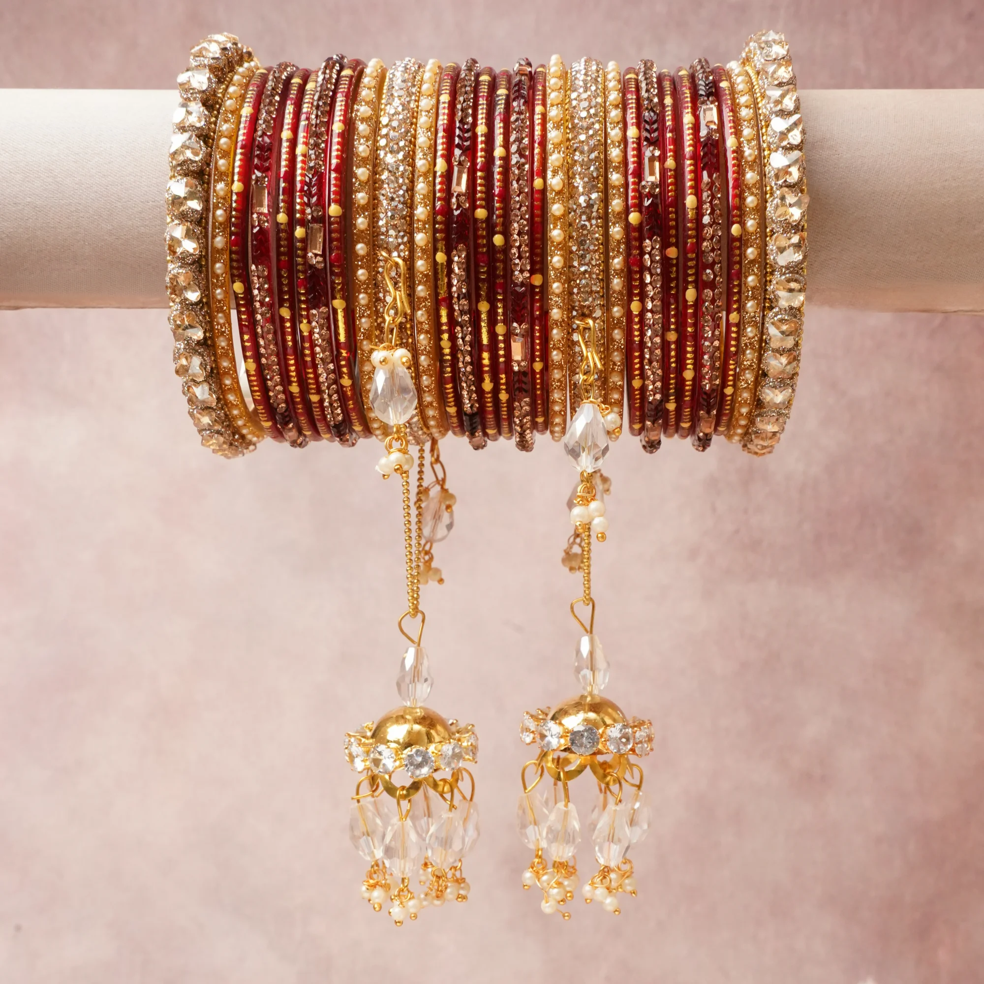 A commanding Deep Burgundy Red anchors this beautiful set, enriched with accents of Gold, Clear Crystal that add depth and dimension.

Featuring a striking composition of Glass Beads and Gold-Tone Metal, this set carries intricate craftsmanship and strong presence. Grand in form, it is created for moments that deserve to be marked.
