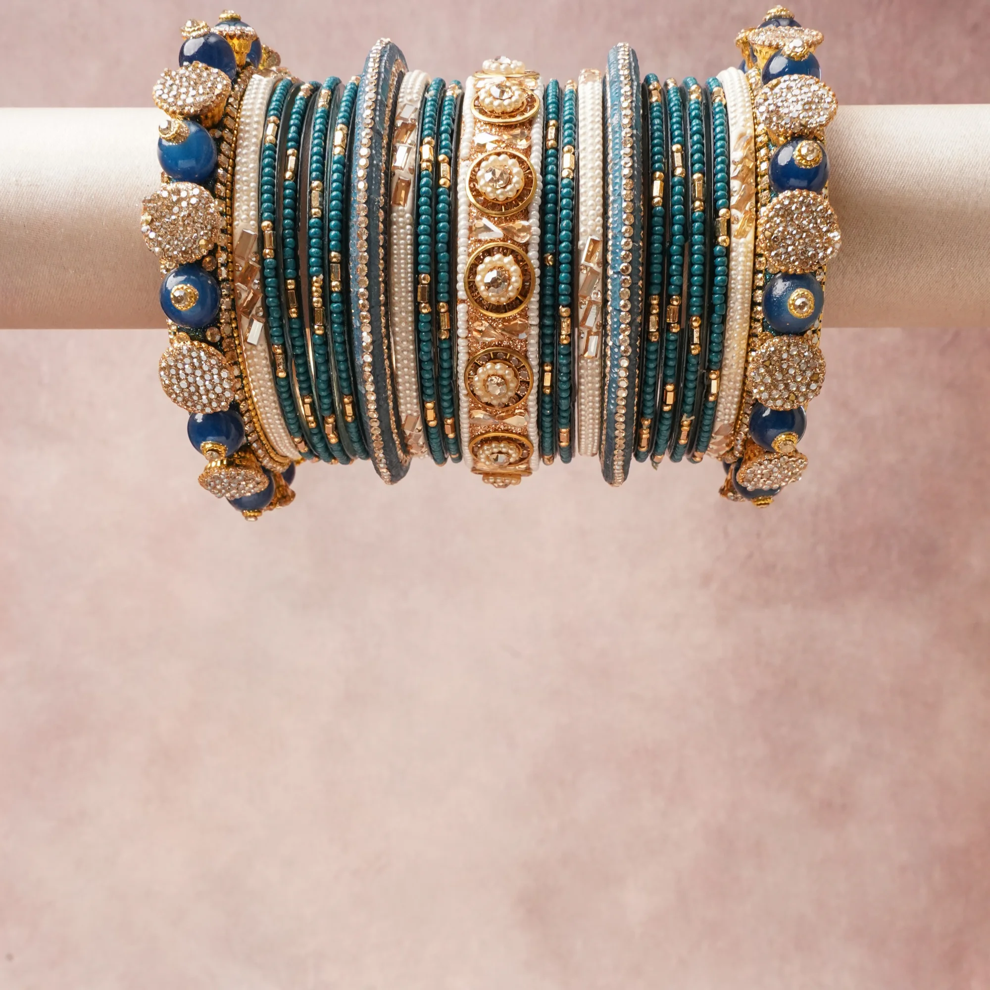 A commanding teal anchors this beautiful set, enriched with accents of gold, ivory, royal blue that add depth and dimension.

Featuring a striking composition of beaded costume jewelry, this set carries intricate craftsmanship and strong presence. Grand in form, it is created for moments that deserve to be marked.