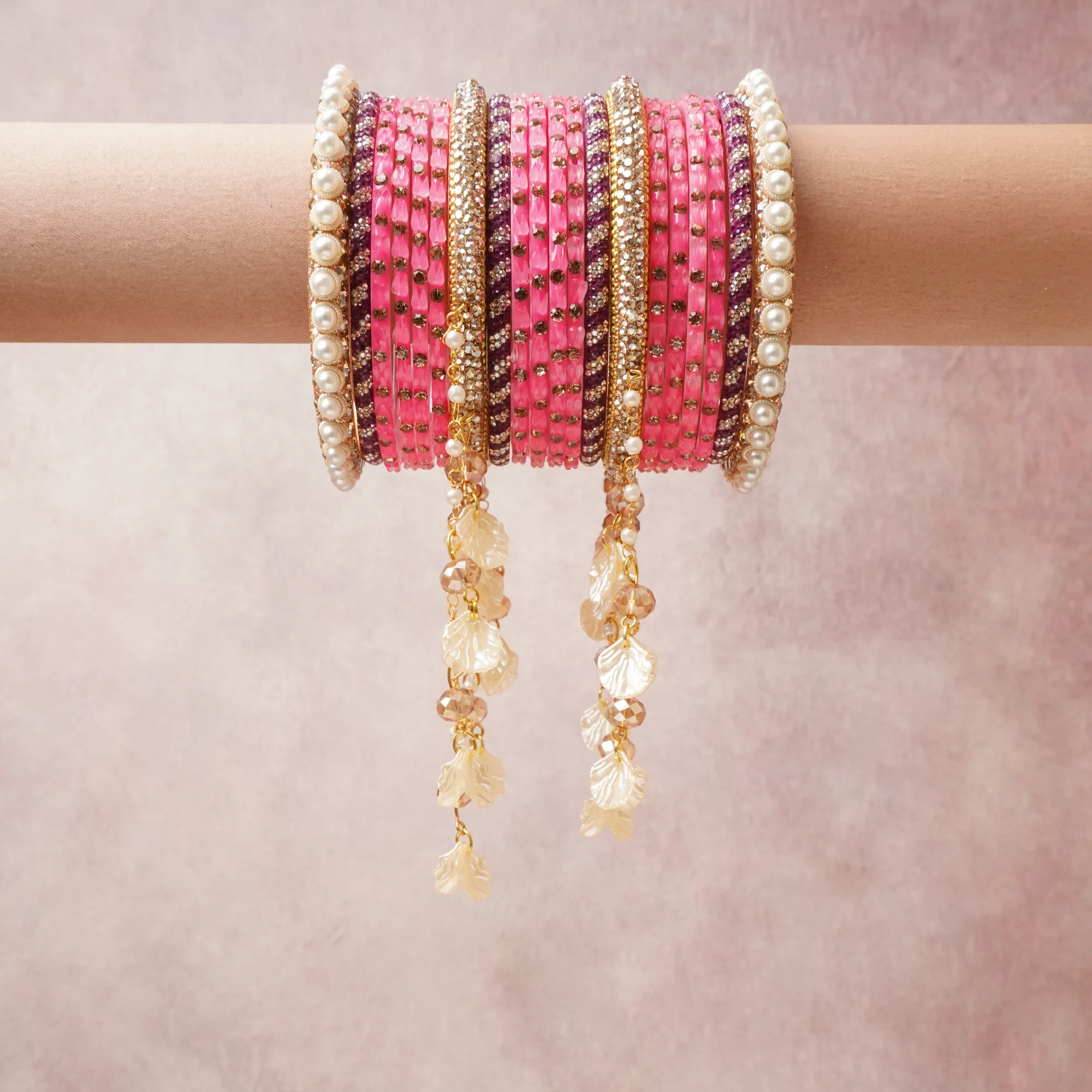 A commanding hot pink anchors this beautiful set, enriched with accents of gold, ivory, deep purple that add depth and dimension.

Featuring a striking composition of glass beads, faux pearls, gold-tone metal, this set carries intricate craftsmanship and strong presence. Grand in form, it is created for moments that deserve to be marked.