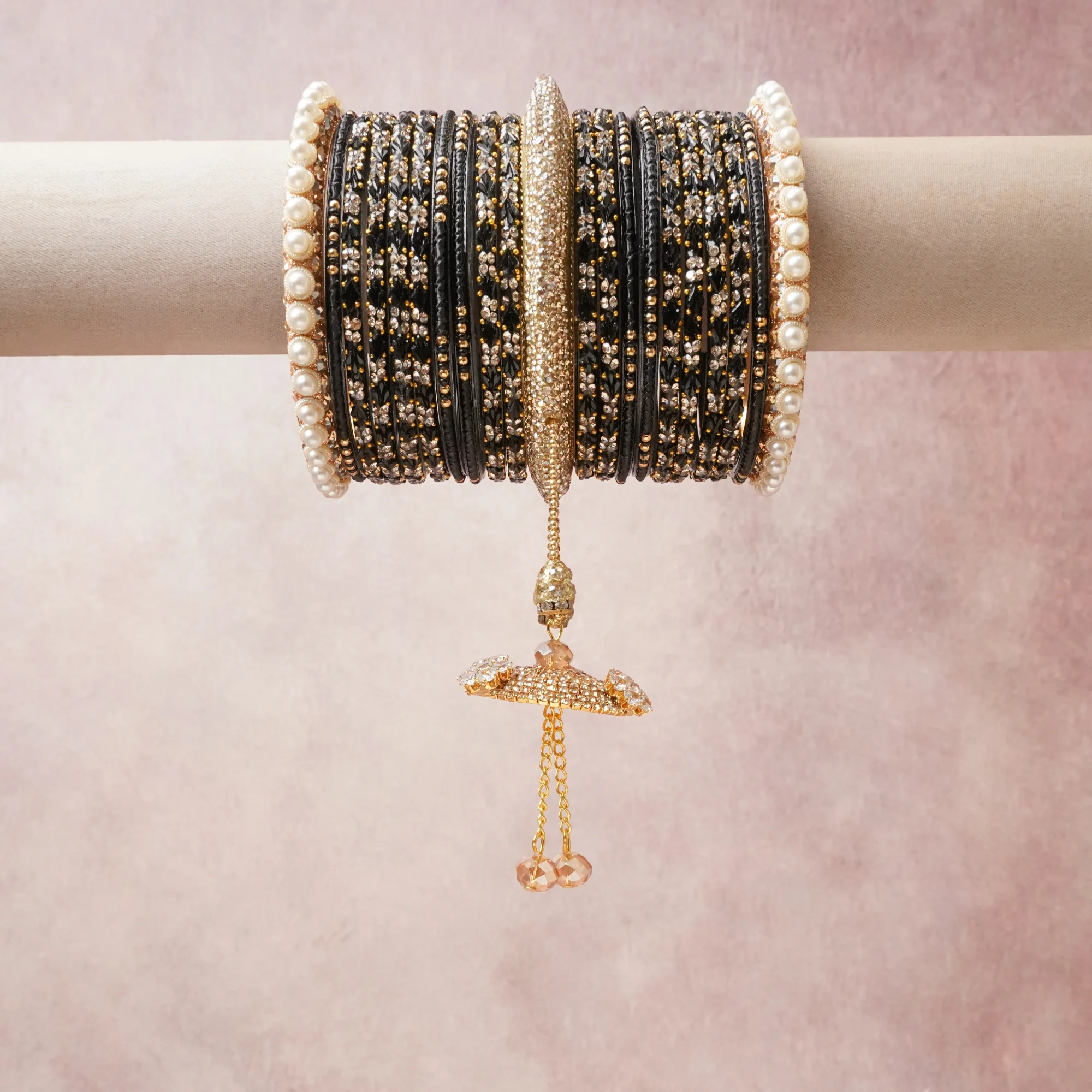A commanding Black anchors this beautiful set, enriched with accents of Gold, Ivory, Champagne that add depth and dimension.

Featuring a striking composition of Glass beads, faux pearls, rhinestones, gold-tone metal, this set carries intricate craftsmanship and strong presence. Grand in form, it is created for moments that deserve to be marked.