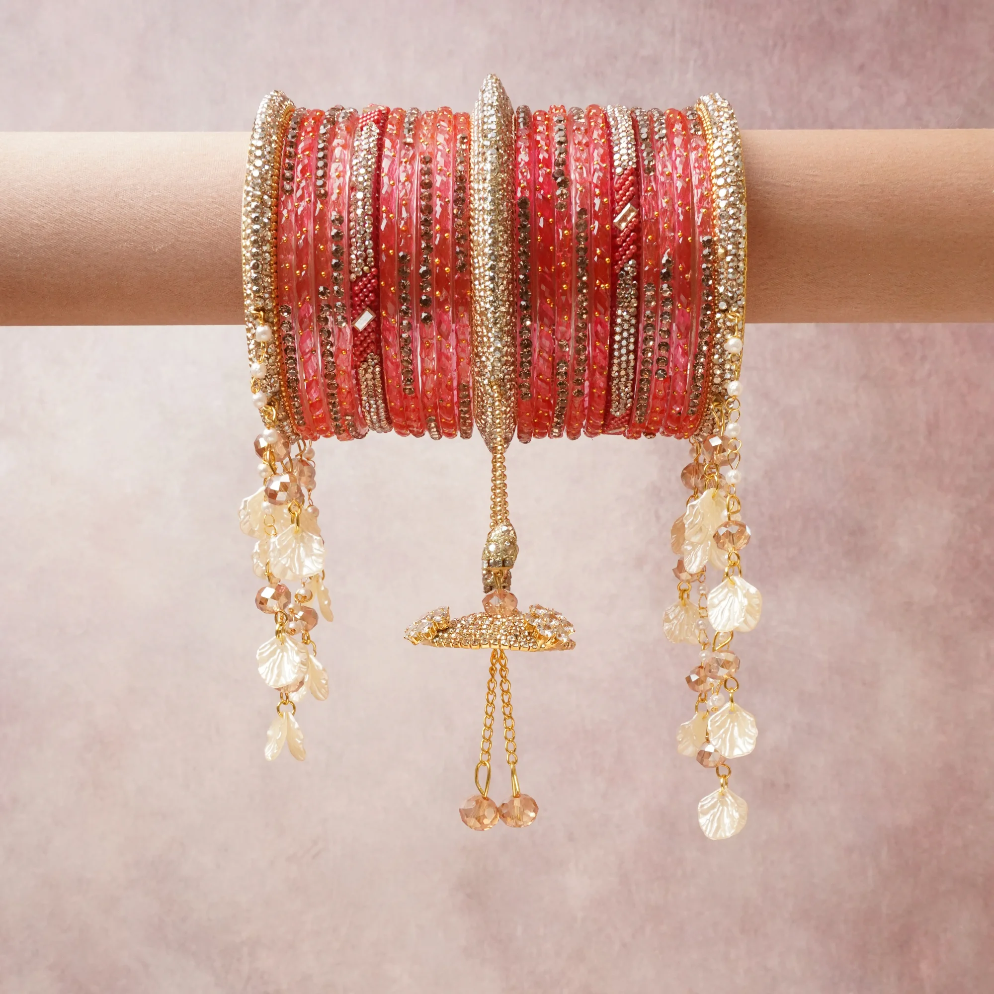 A commanding coral pink anchors this beautiful set, enriched with accents of gold, champagne, ivory that add depth and dimension.

Featuring a striking composition of crystal beads, rhinestone, gold-tone metal, this set carries intricate craftsmanship and strong presence. Grand in form, it is created for moments that deserve to be marked.