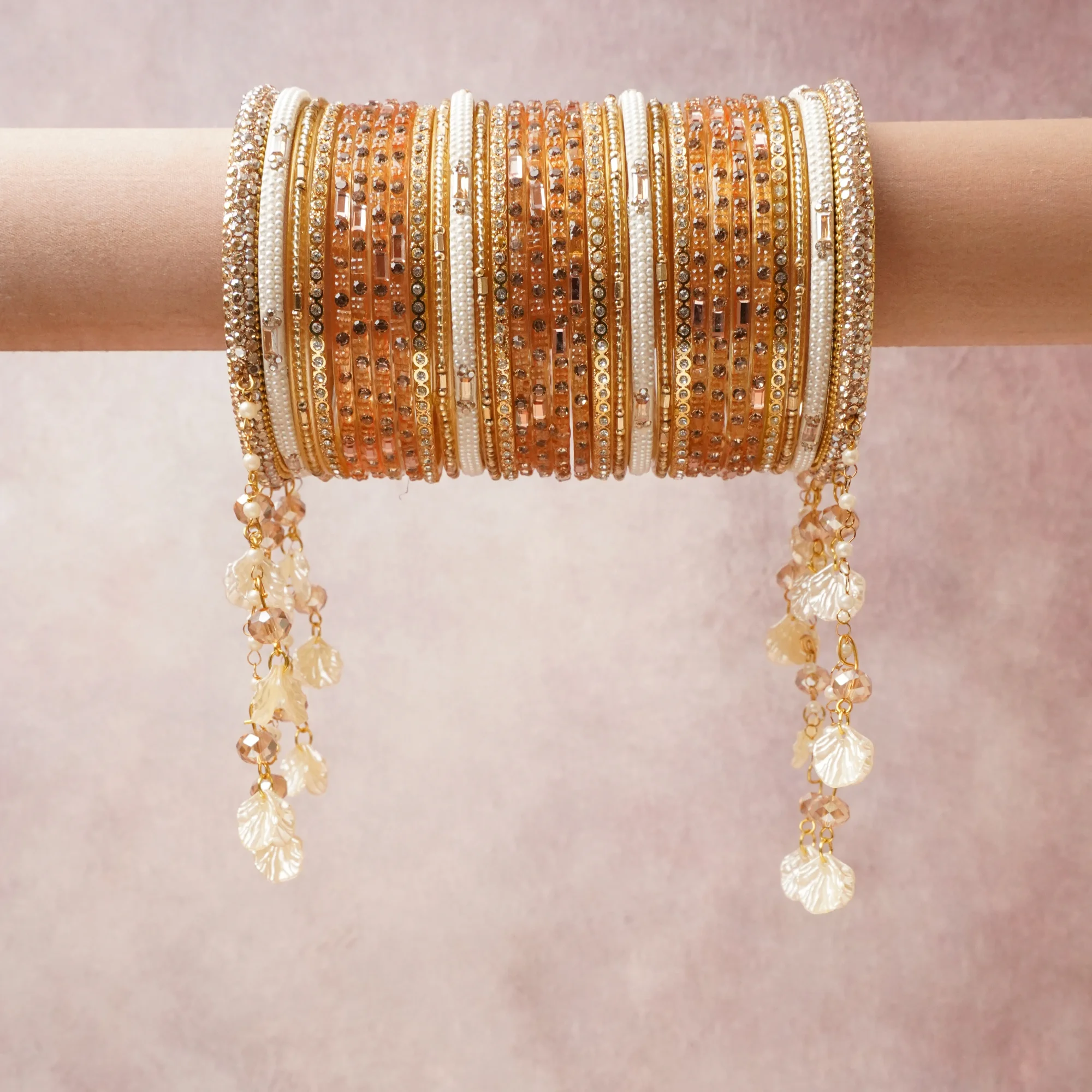 A commanding gold anchors this beautiful set, enriched with accents of ivory, champagne, clear crystal that add depth and dimension.

Featuring a striking composition of glass beads, rhinestones, metal, this set carries intricate craftsmanship and strong presence. Grand in form, it is created for moments that deserve to be marked.